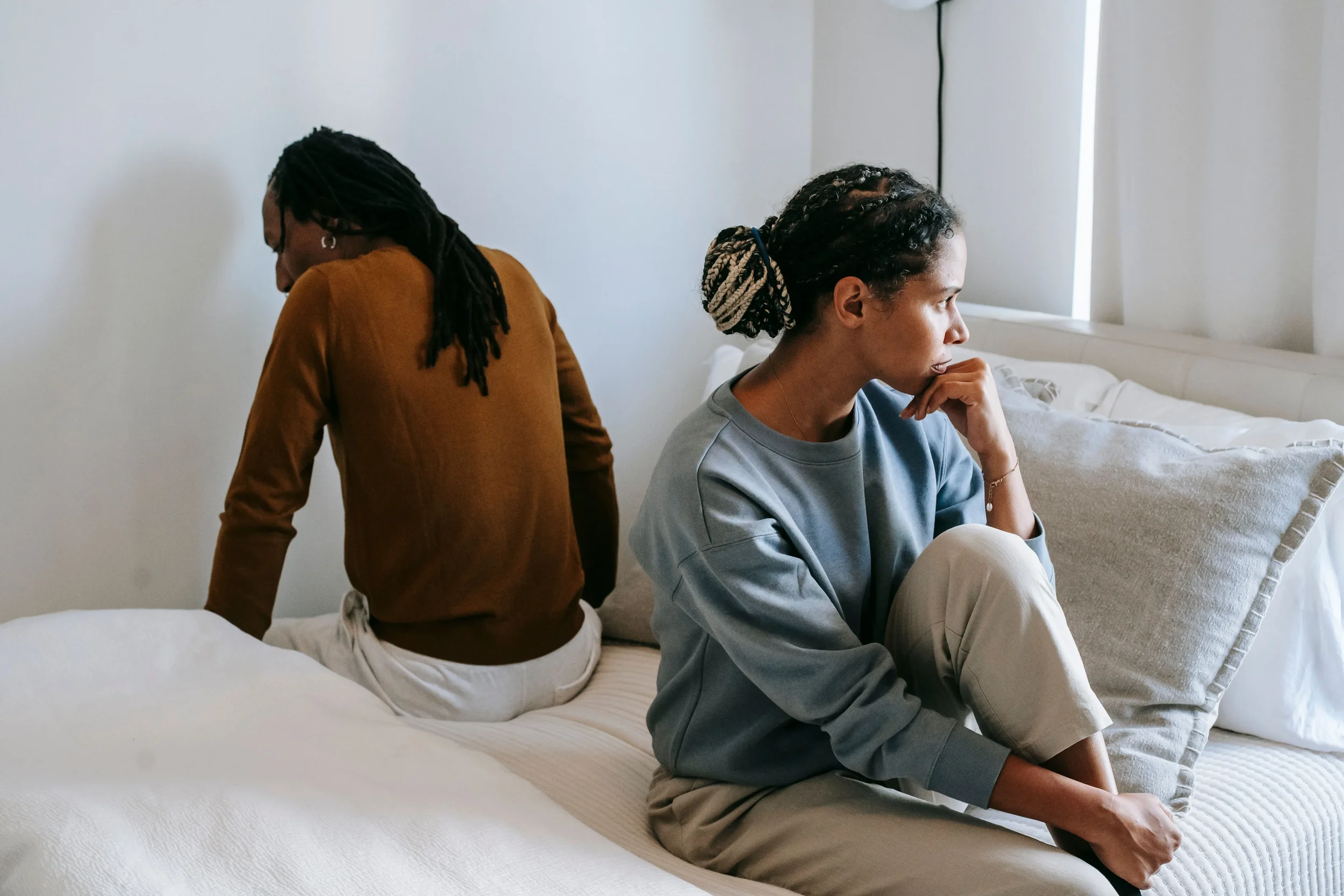 Couple having a difficult conversation while sitting together