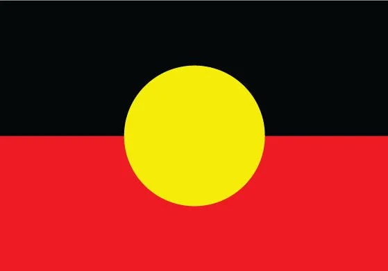 The Aboriginal Australian flag with black, yellow, and red horizontal stripes and a yellow circle in the center.