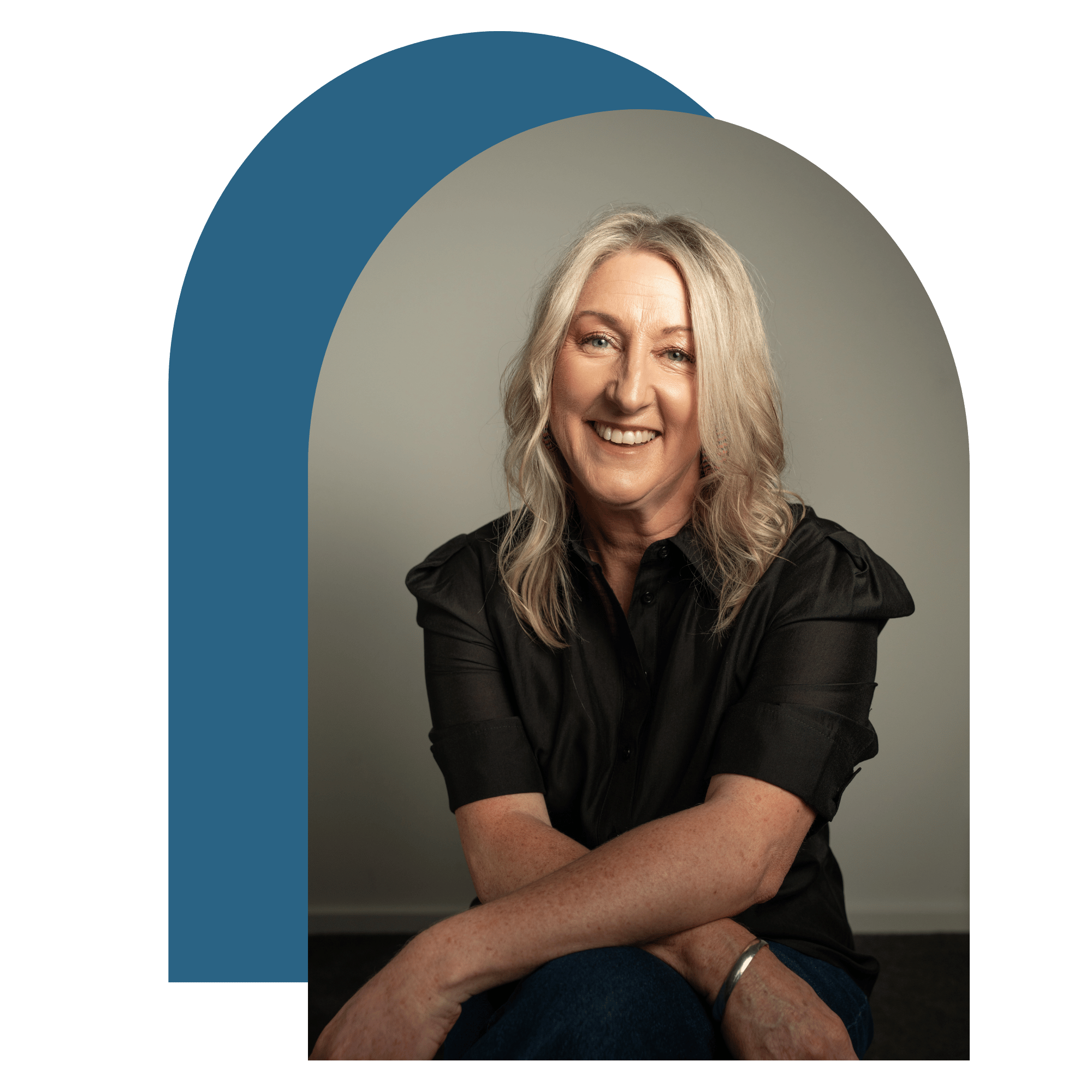 Mel, strengths-based coach in Adelaide, smiling in a café setting