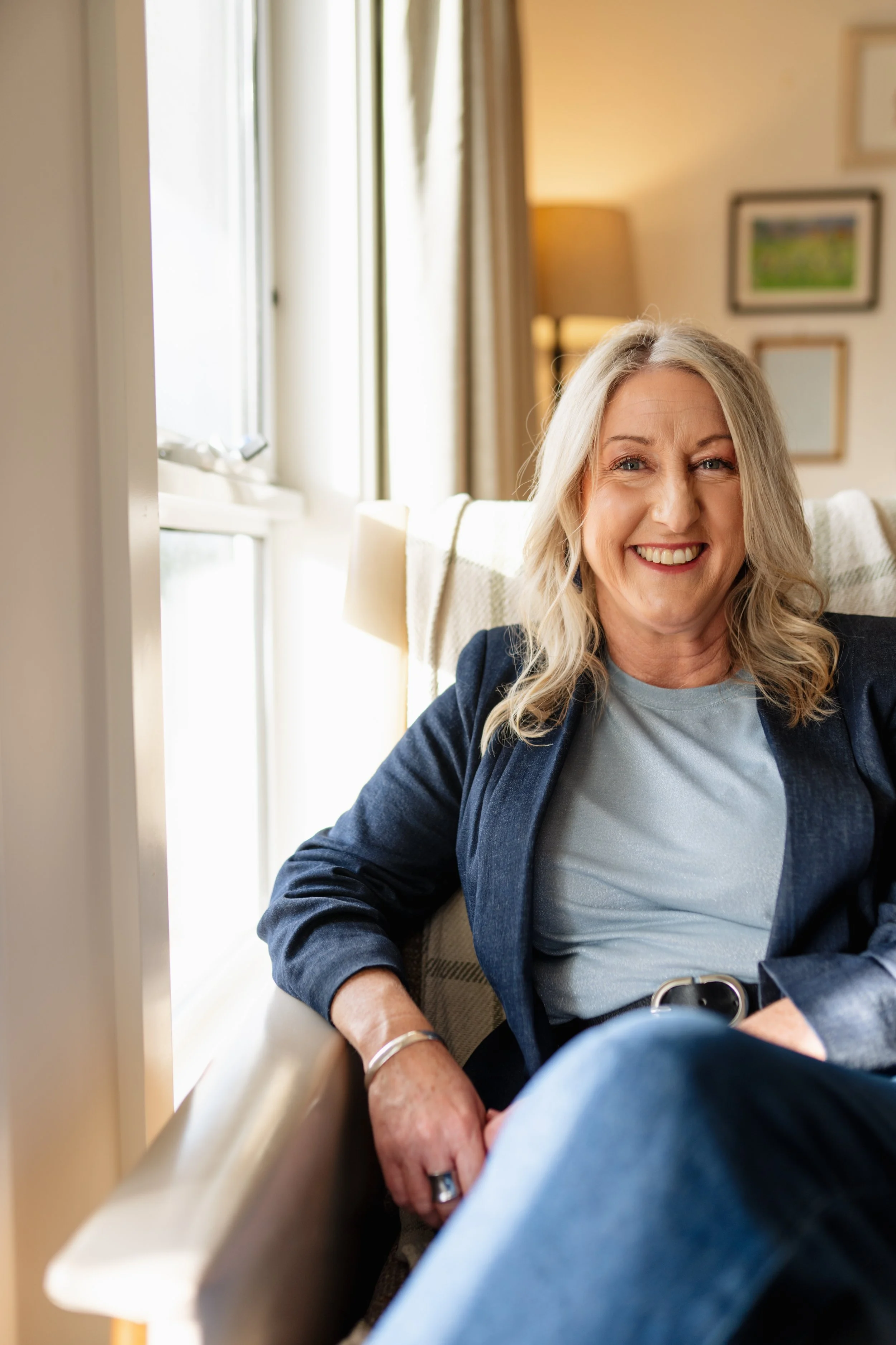 Mel seated and smiling, positive psychology coach offering coaching in Adelaide and online across Australia