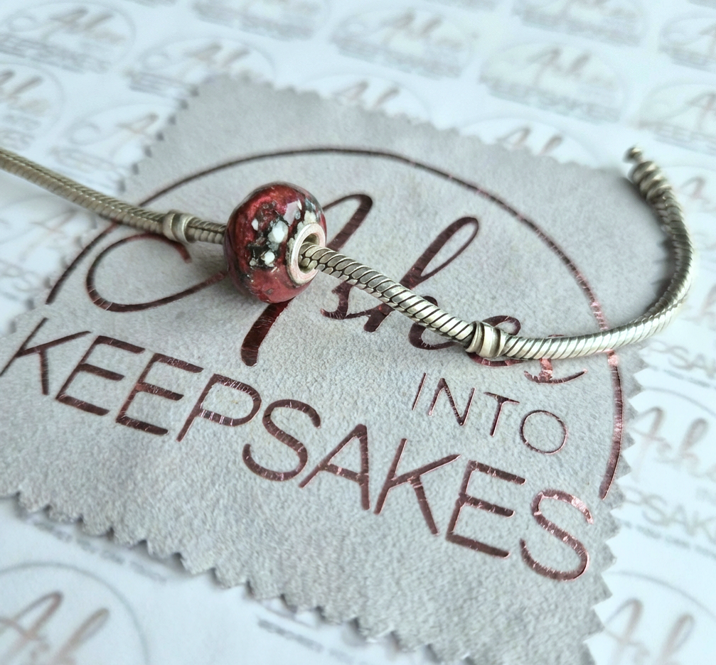 red memorial ashes charm.png