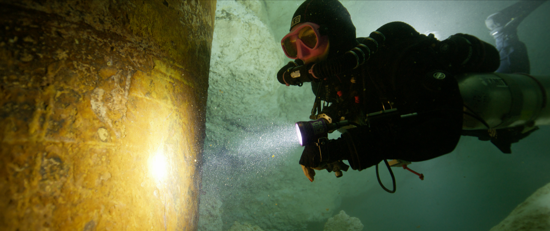 Cave diver Tamara Adame inspecting at pylon from the Tren Maya project