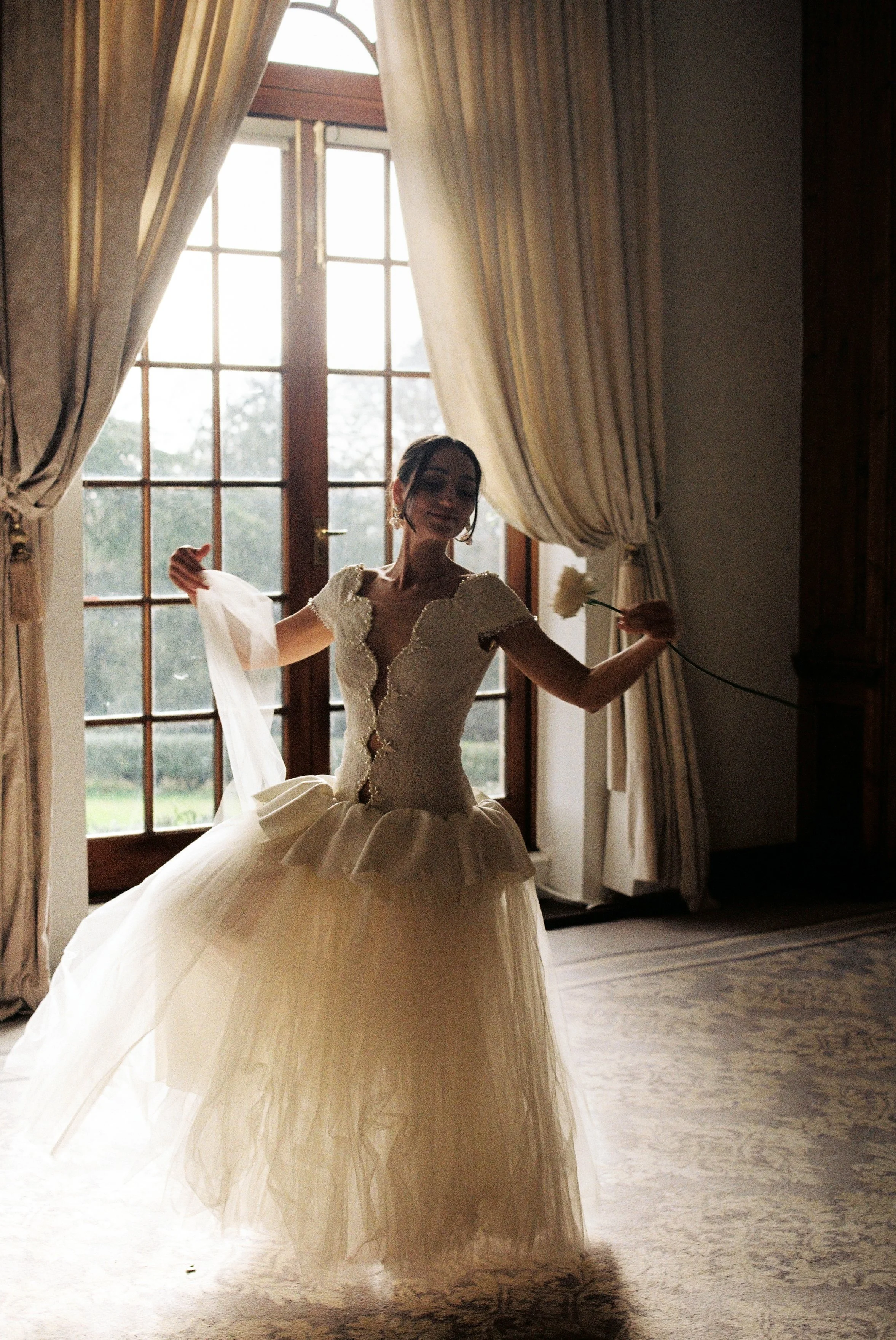 Bride standing by a window at Hedsor House, photographed on Kodak Gold 35mm film