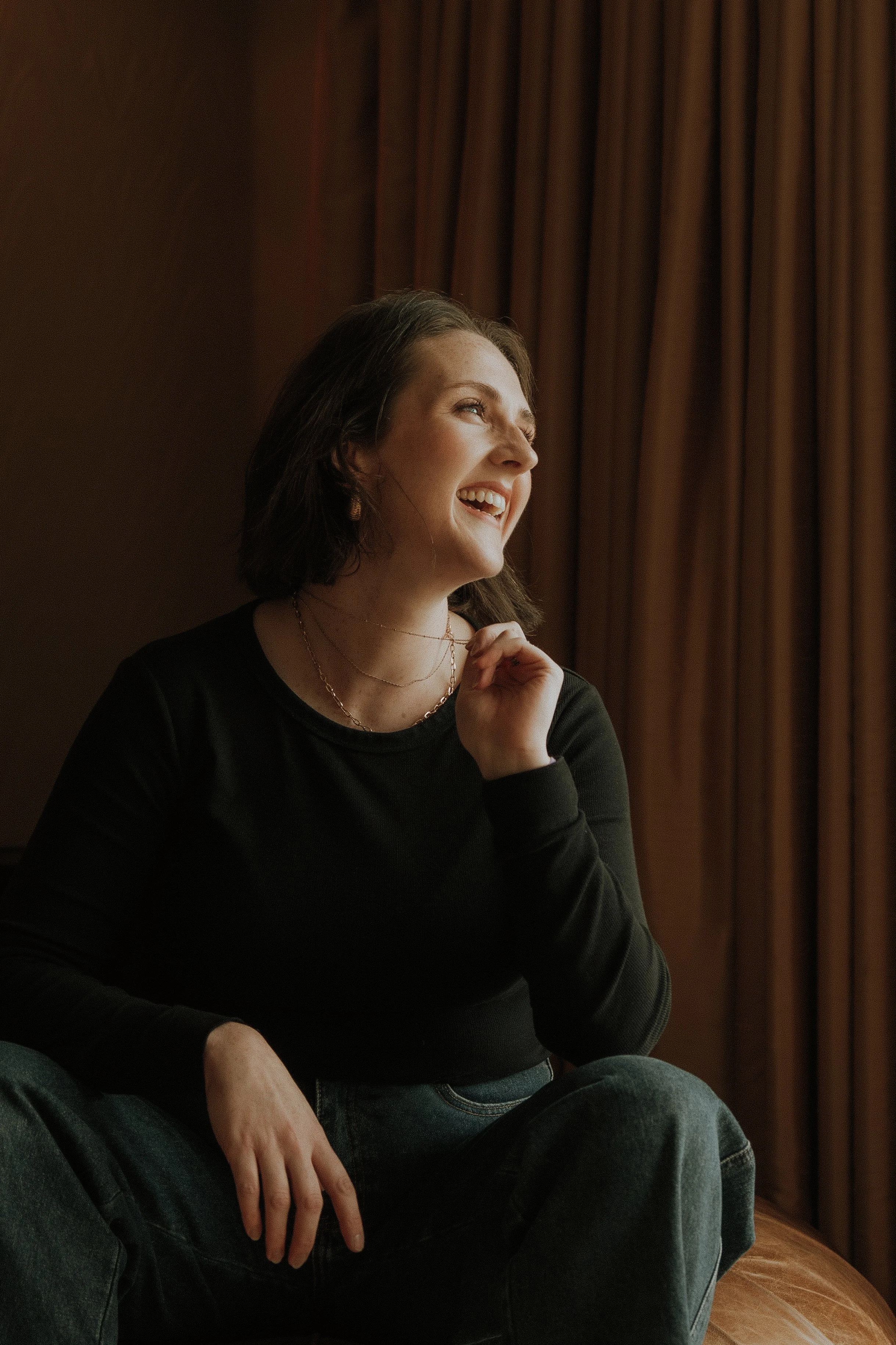 Jacs Batchelor laughing and looking into the distance