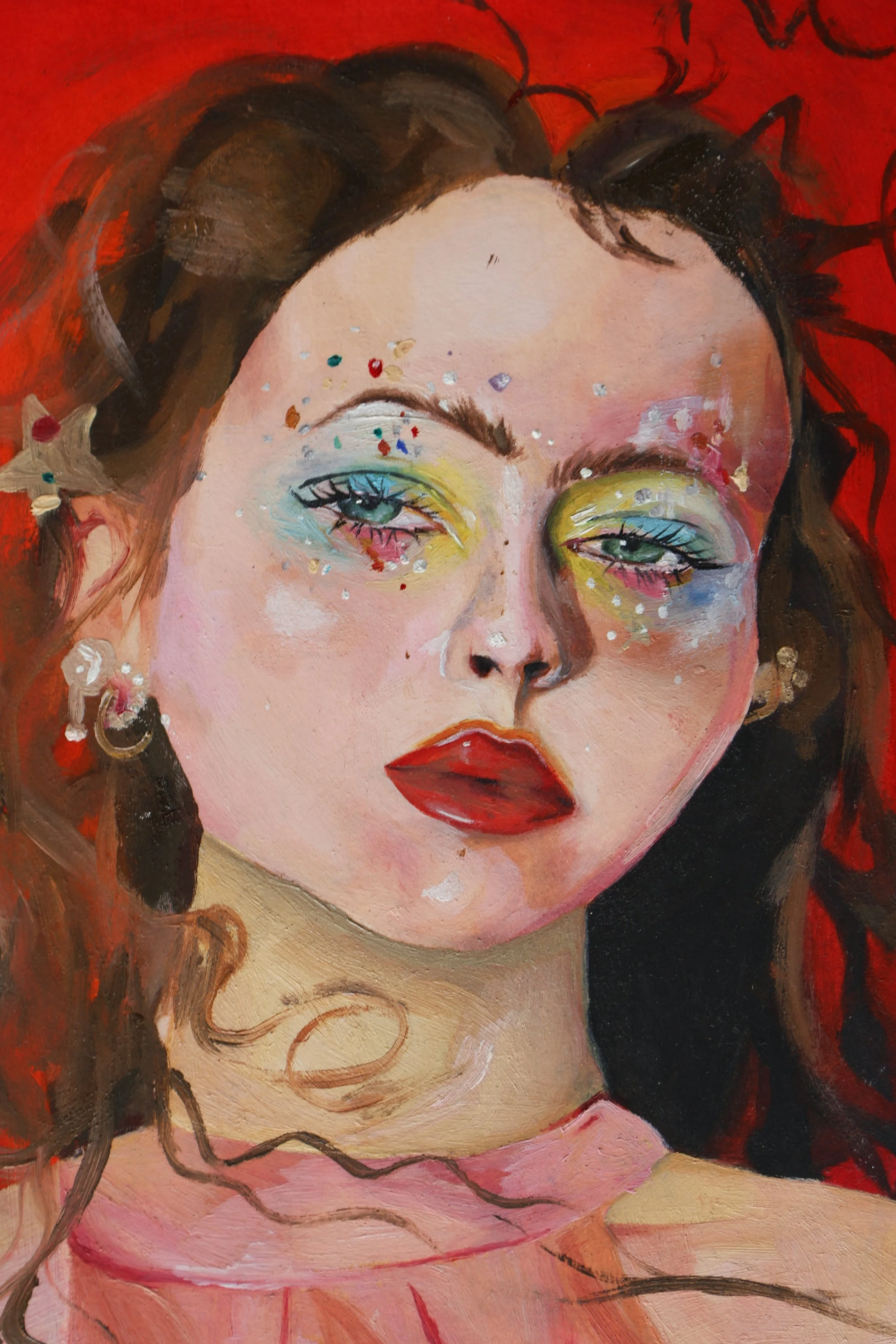 A painting of a woman with light pink skin, yellow eyeshadow, red lipstick, and colorful confetti on her face. She has dark brown hair styled in waves and is wearing a pink top. The background is red with black abstract lines.