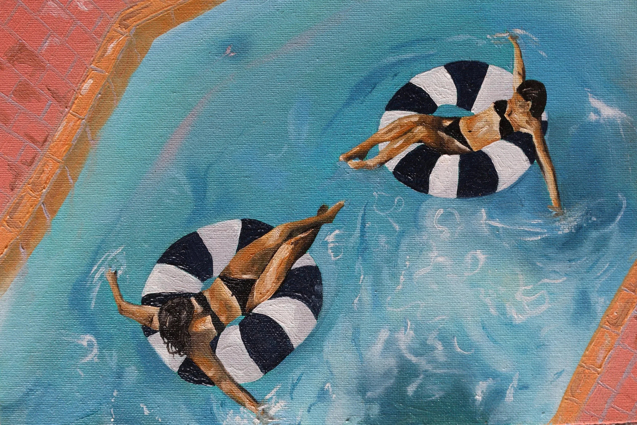 Children playing in a swimming pool with a brick edge, two kids are on a black-and-white striped inner tube in the water.