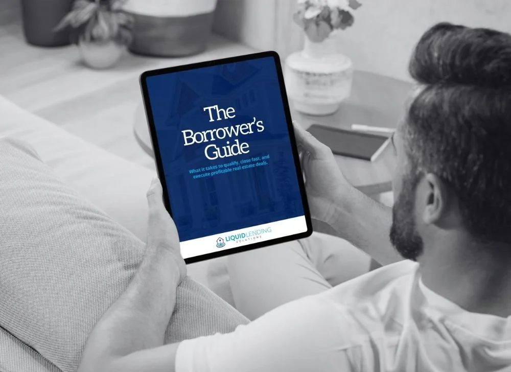 Liquid Lending Borrower's Guide on an ipad with someone reading it in their chair