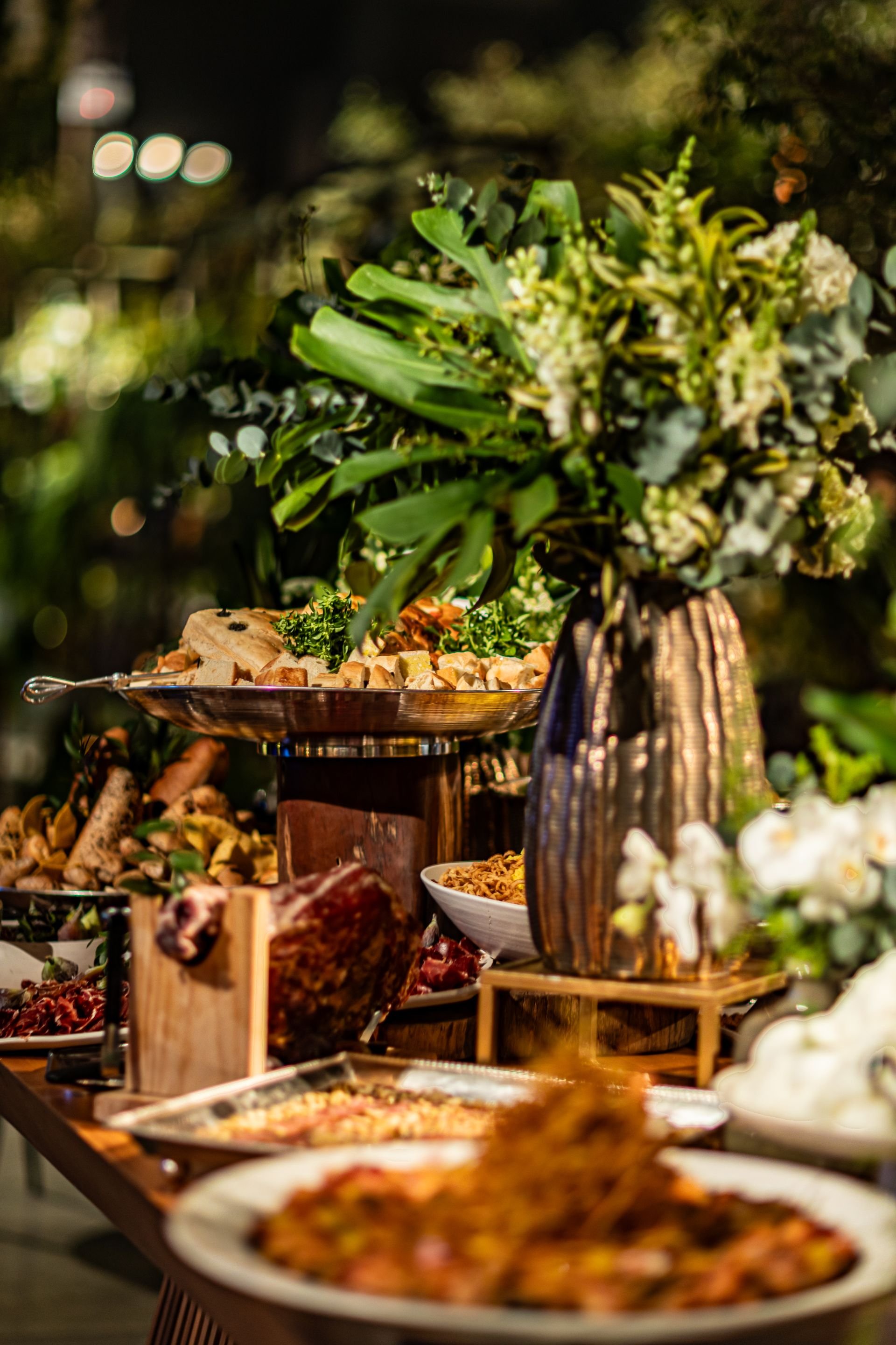 Catering buffet with breads and dips, plant decor