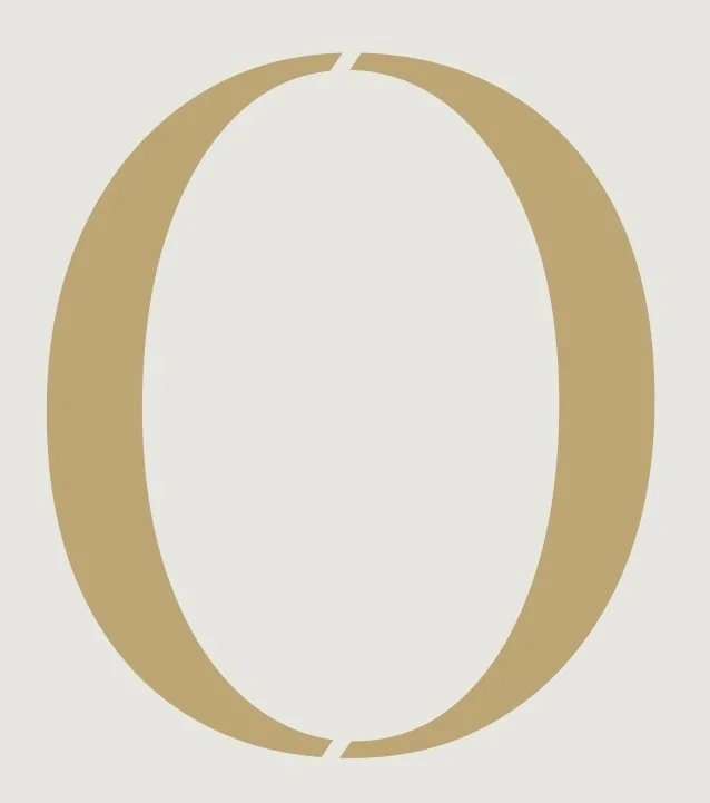 A large, stylized gold number zero with a small break in the upper left and lower right parts, set against a light background.