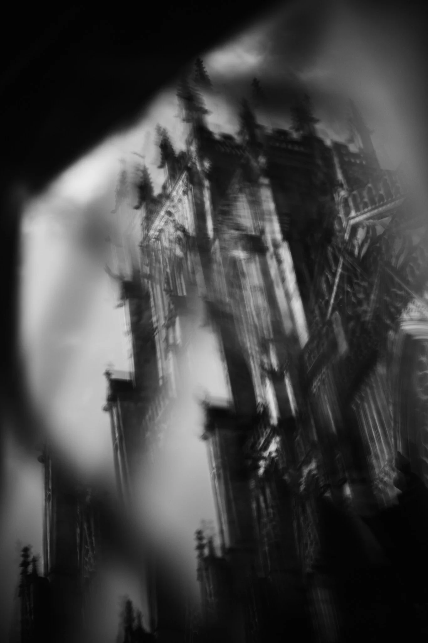 York Minster viewed through the textured glass of an old leaded window, transforming the familiar architecture into abstract light and pattern.