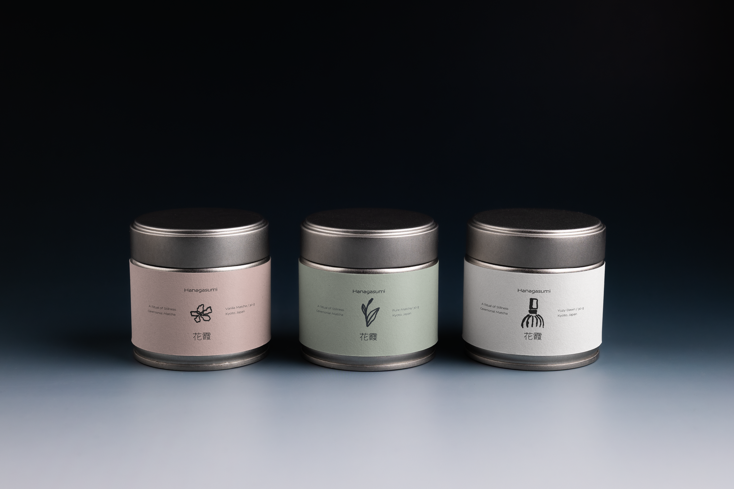 Three cans of matcha tea in pastel-colored packaging with minimalist black illustrations and Japanese text, set against a dark background.