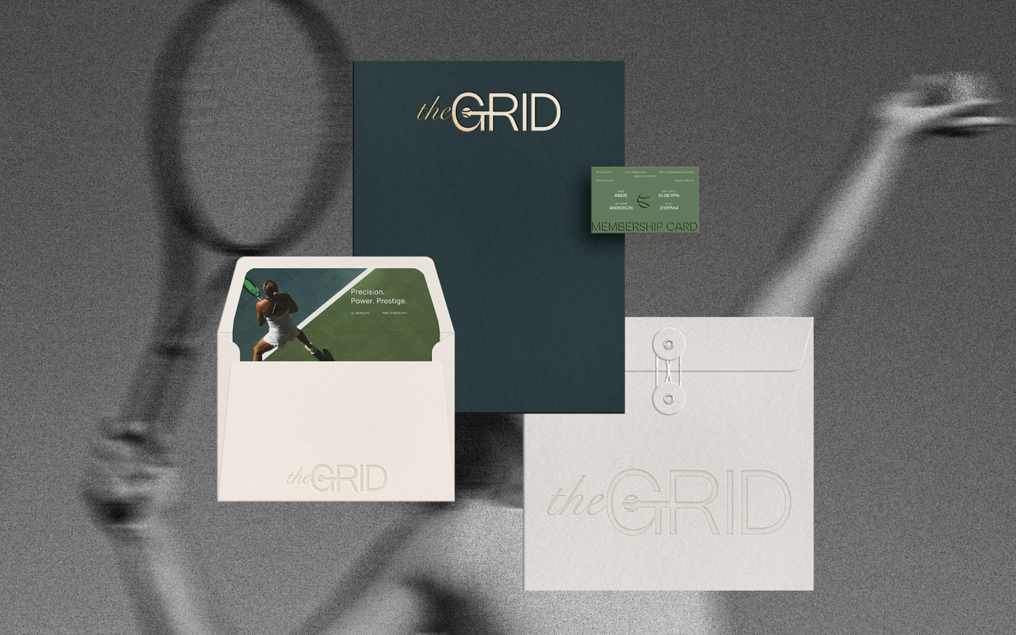 A tennis-themed subscription box set with branding 'the GRID,' including a membership card, an envelope with a tennis player on the inside, and a white envelope with embossed 'the GRID' logo, all placed on a textured gray surface.