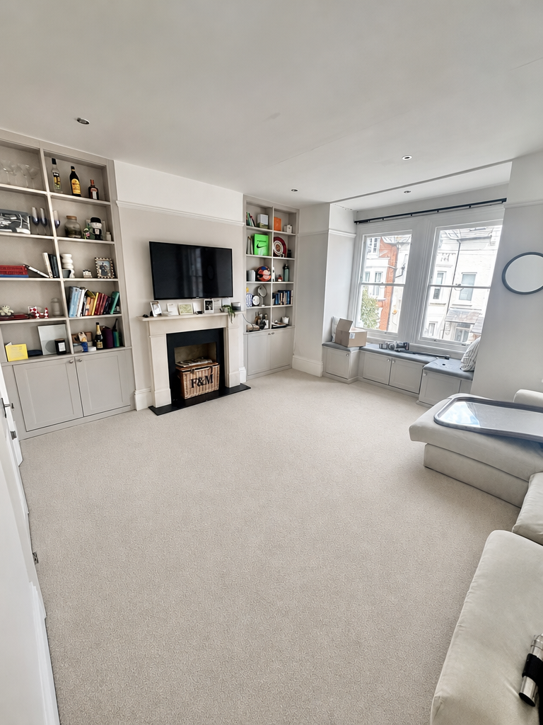 Professional carpet cleaning results in a modern living room in Clapham, South West London.