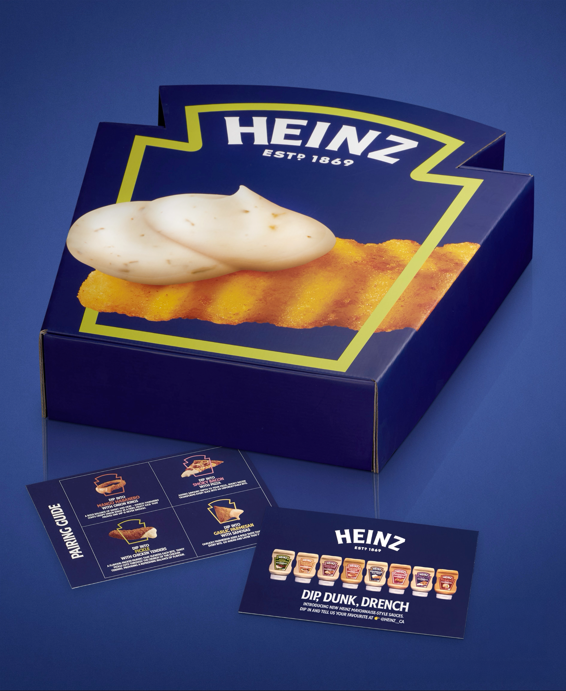 Heinz mayonnaise product box with images of different mayonnaise bottles, a dipping guide, and a sample dip with fries on a blue background.