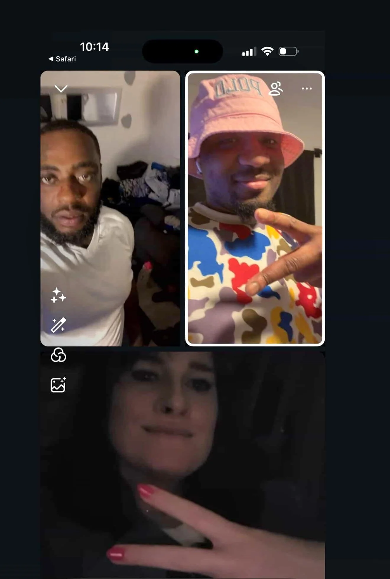 Two men appear on a video call screen. The man on the left has a beard and is wearing a white shirt, with a cluttered room in the background. The man on the right is wearing a pink bucket hat with the word 'POLIT' on it and a colorful patterned shirt