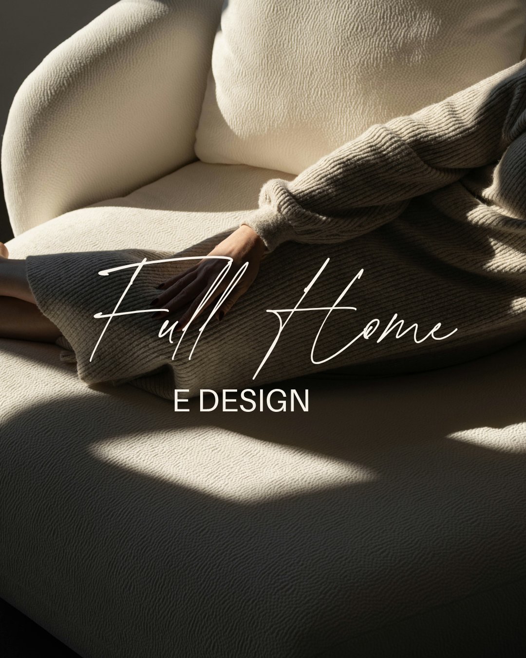 Close-up of a person sitting on a beige textured sofa, wearing a grey sweater, with text overlay that reads 'Full Home E DESIGN' in elegant script.