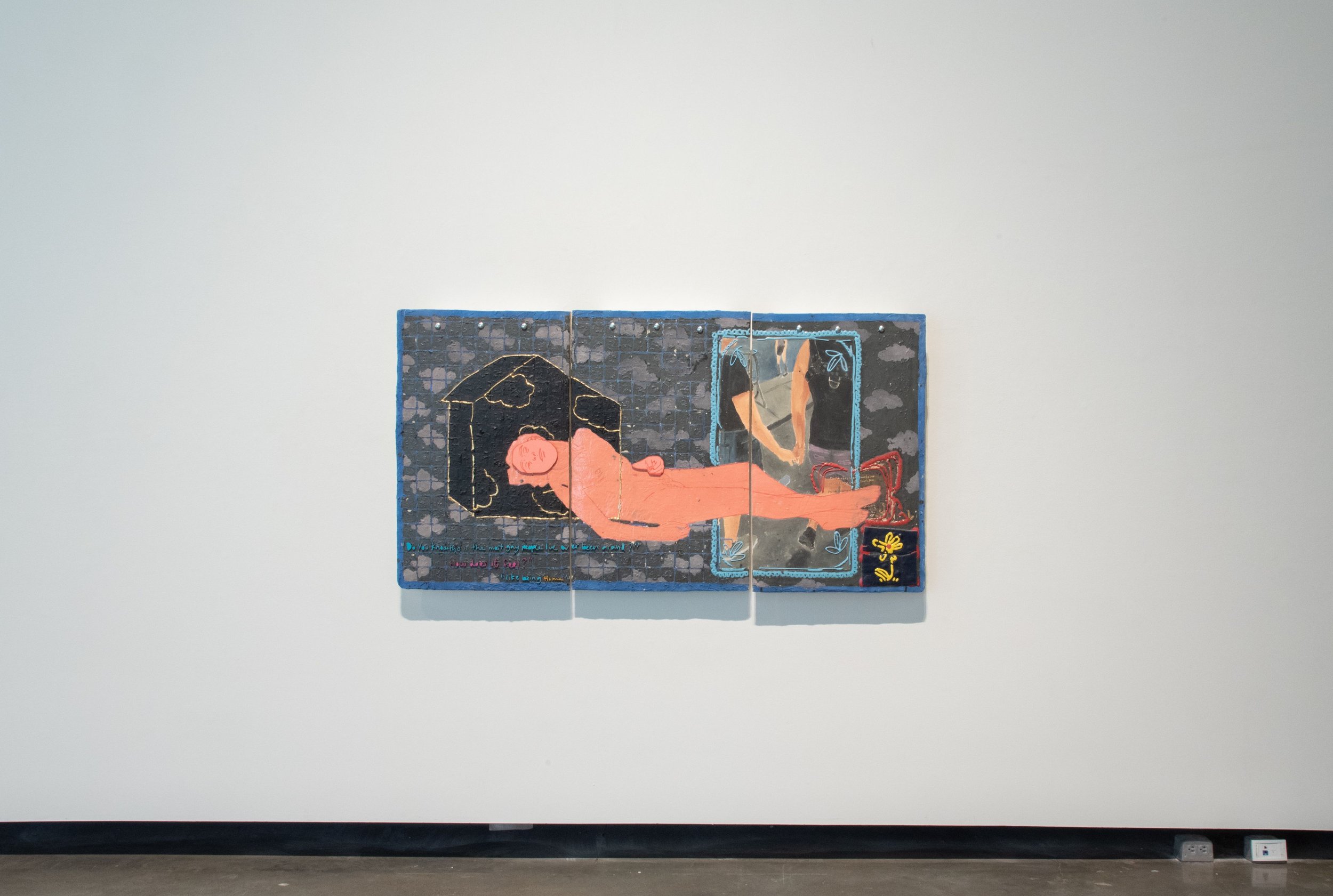 Multi-panel artwork on a white gallery wall depicting a reclining person with a halo-like shape above their head, and a colorful, floral frame surrounding a section with a woman's legs, accompanied by handwritten text.