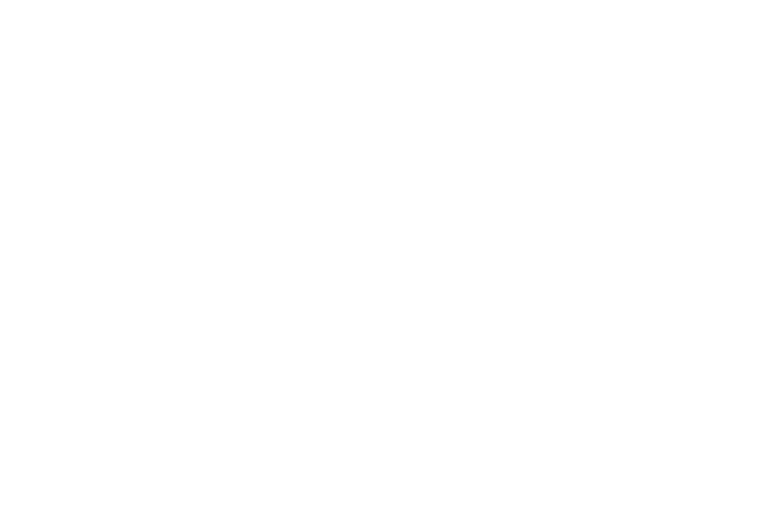 Neon sign with the word 'Donut' written in cursive inside an oval. The sign is illuminated in white against a black background.