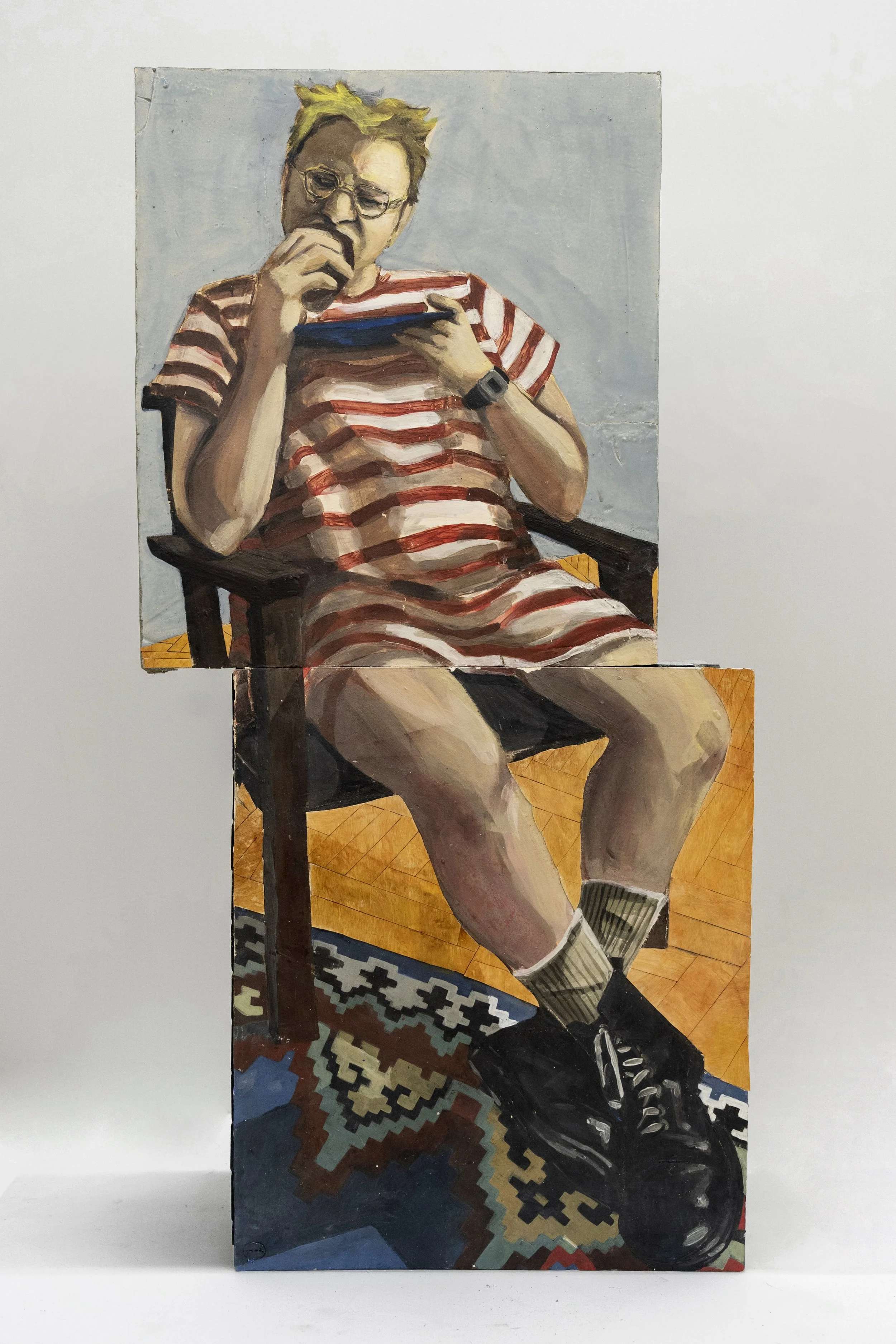 Painting of a young person with short blond hair wearing glasses and a red and white striped t-shirt, sitting on a wooden chair, reading a book with one hand on their chin, on a wooden floor with patterned rugs.