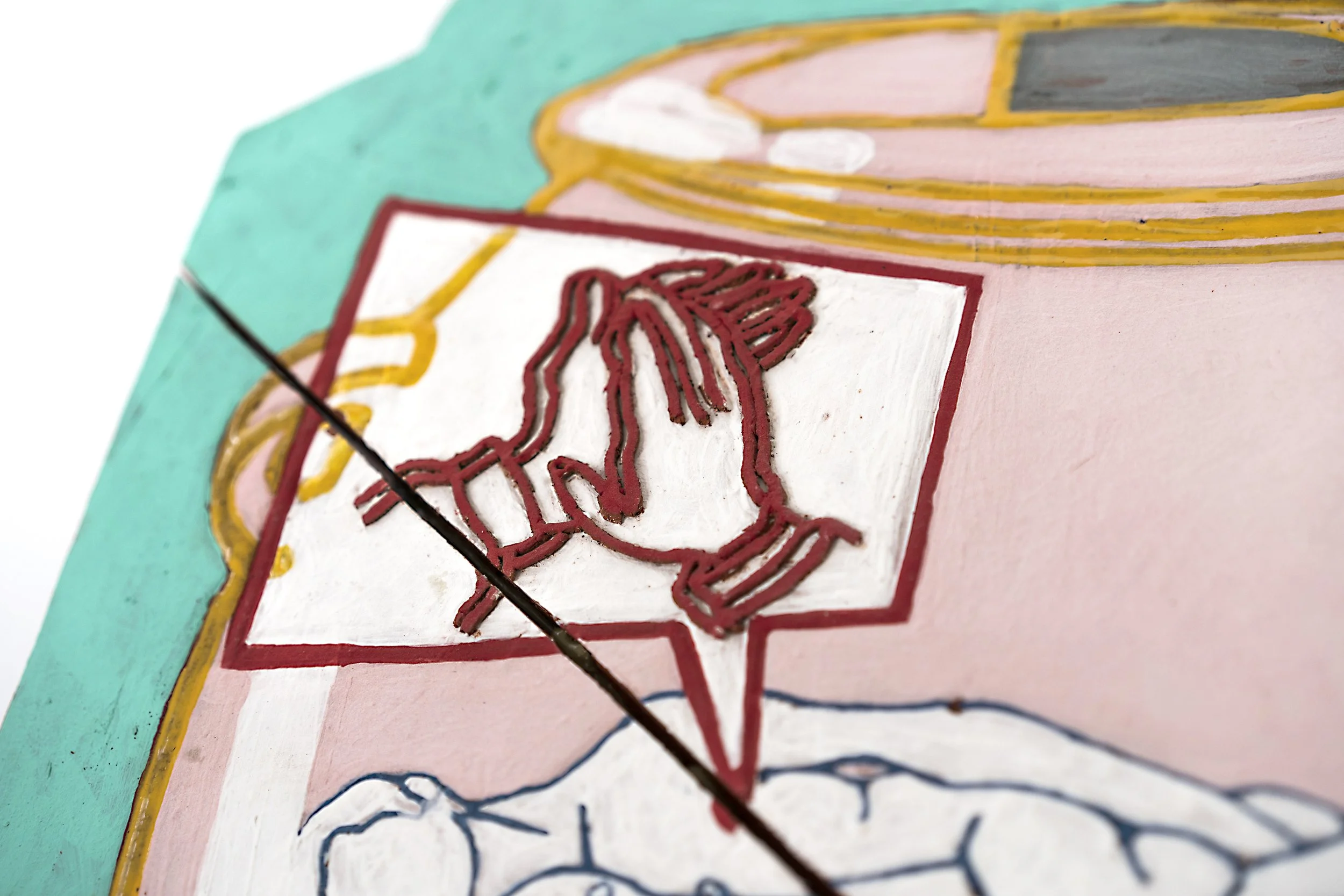 Close-up view of hand-painted signage with a red dog silhouette outlined in red, set on a pink background, with part of a blue and yellow border visible.