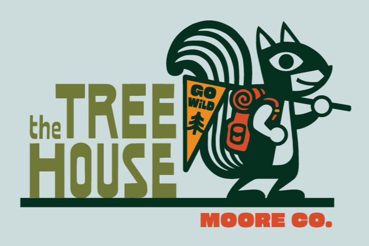 Logo for The Tree House Moore Co. featuring a stylized cartoon raccoon with a backpack and flashlight, with a sign saying 'Go Wild' and trees in the background.