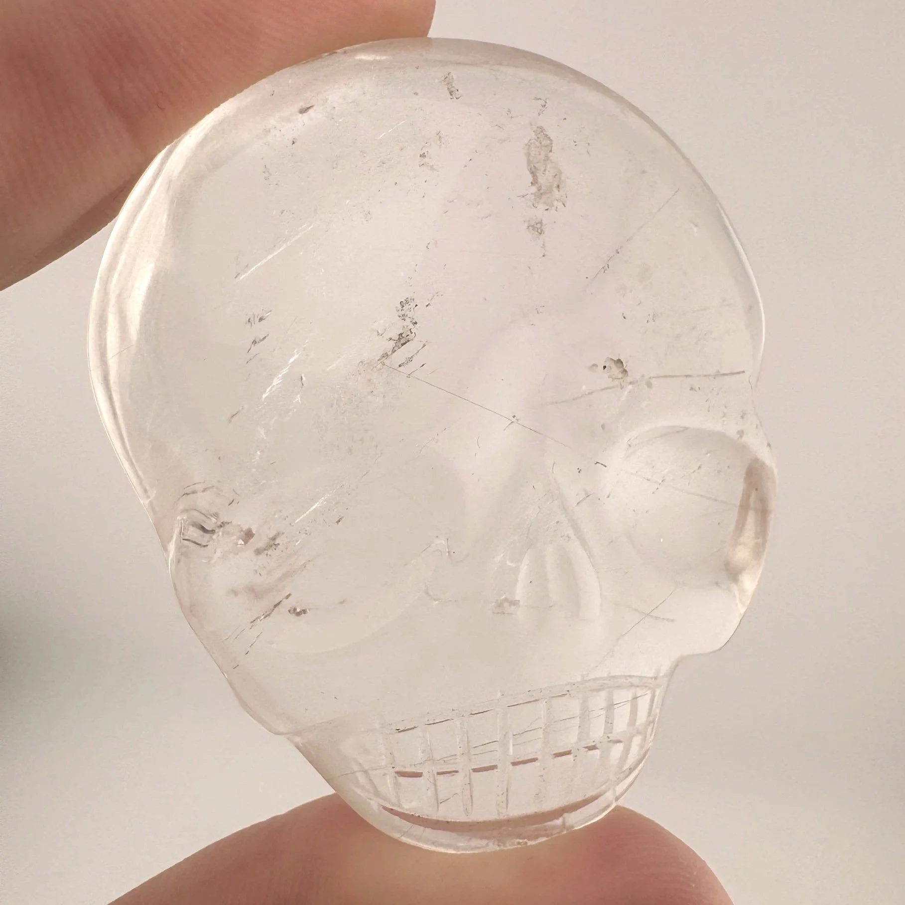 Leandro de Souza Red Rutile in Quartz Magical Child Palm Skull