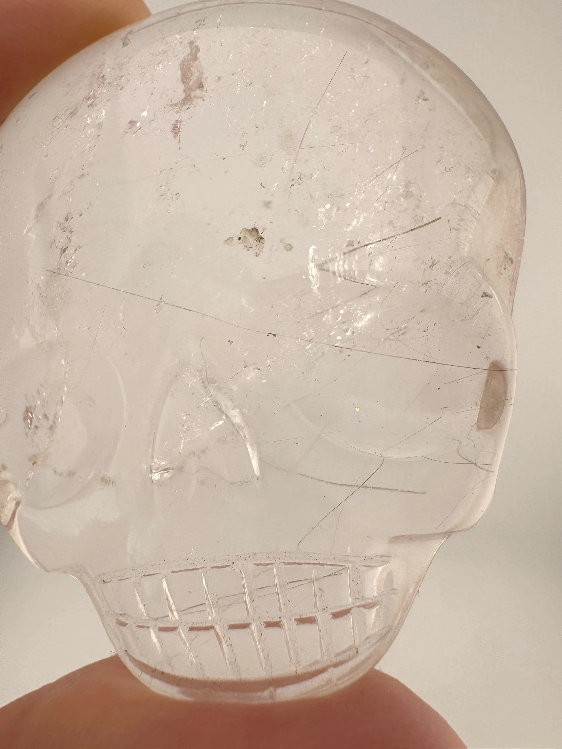 Leandro de Souza Red Rutile in Quartz Magical Child Palm Skull