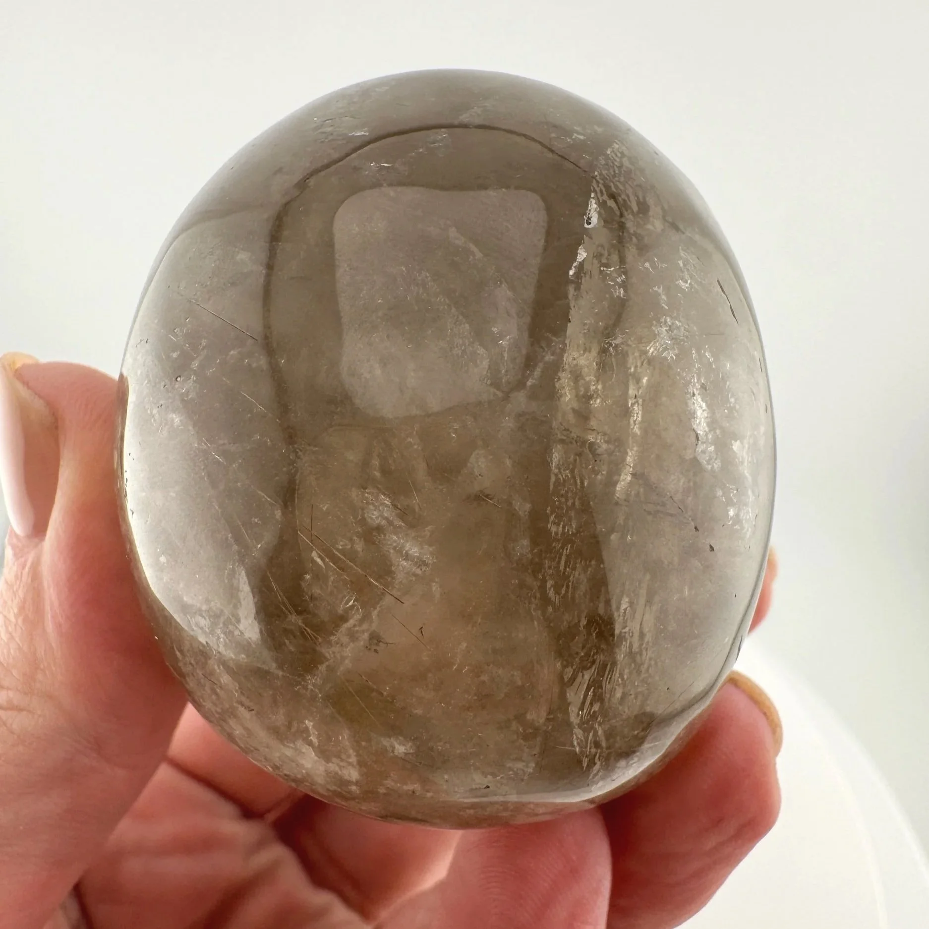 Red Rutile in Smoky Quartz Skull carved by Leandro de Souza