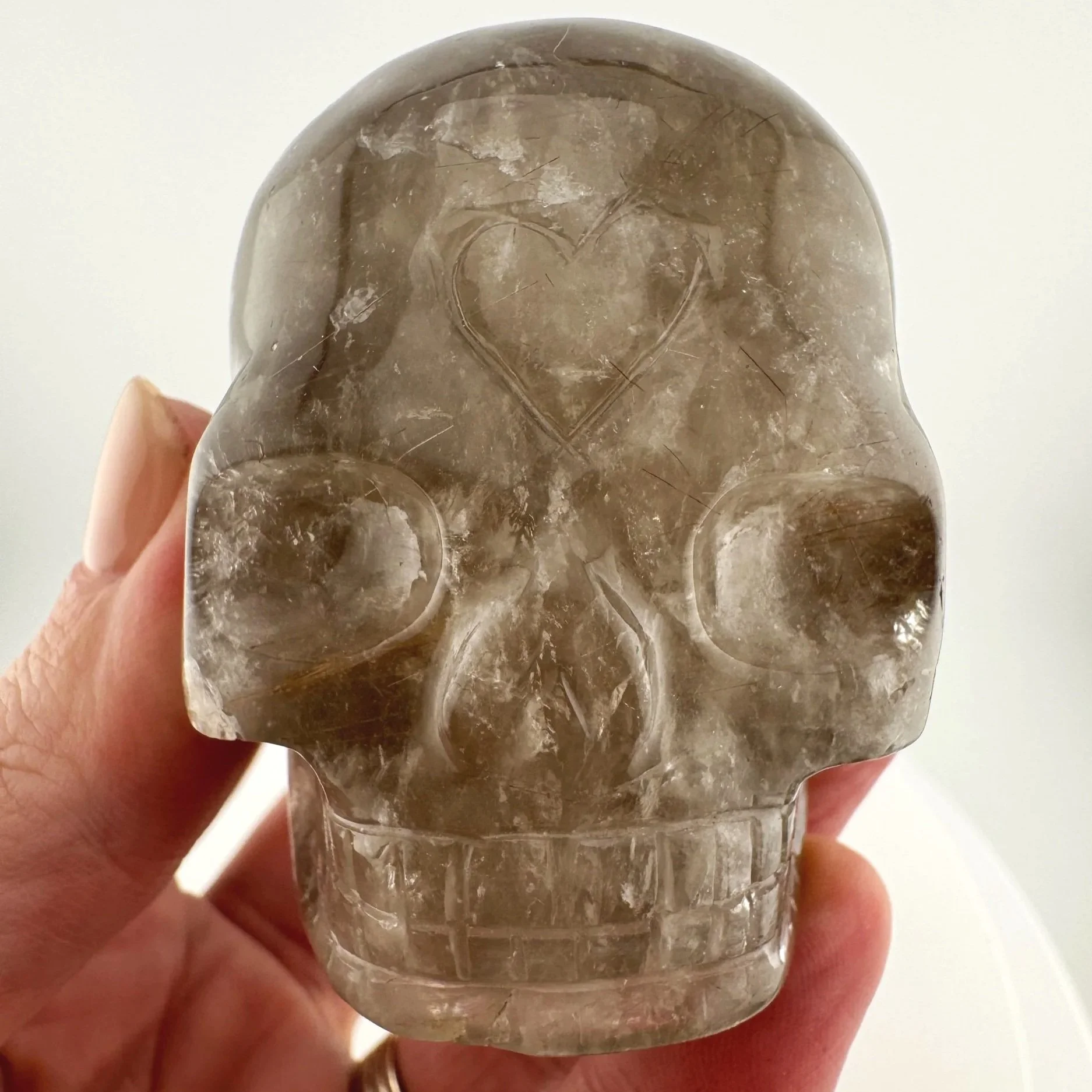 Red Rutile in Smoky Quartz Skull carved by Leandro de Souza