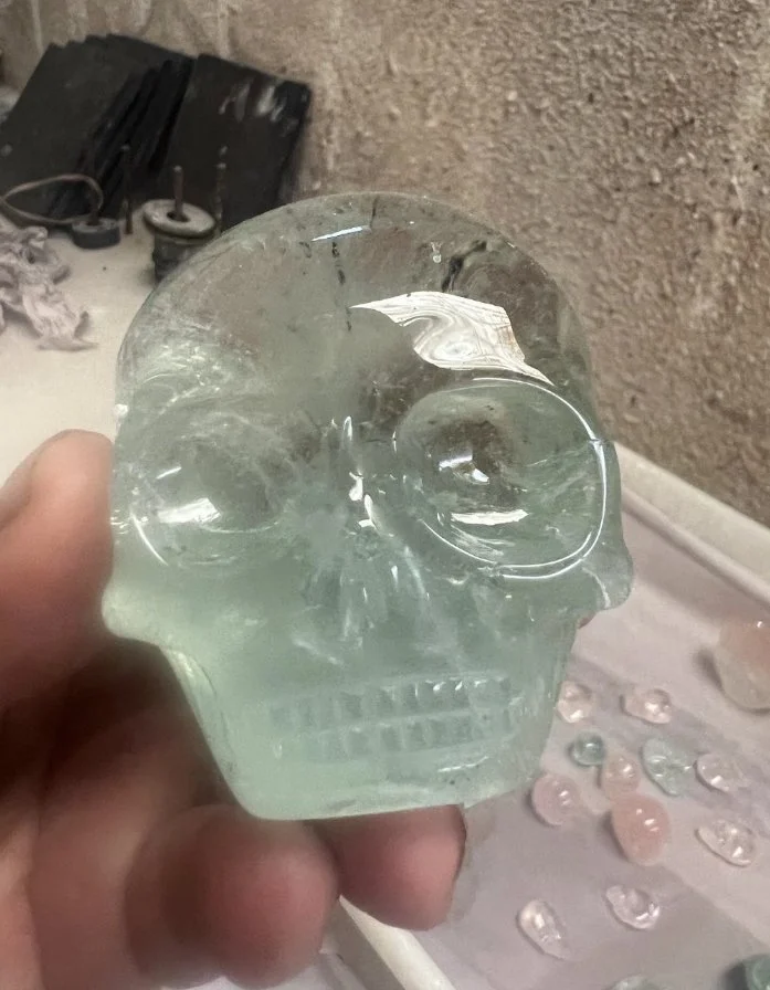 Gem Aquamarine Shaman Skull carved by Leandro de Souza in 2024.