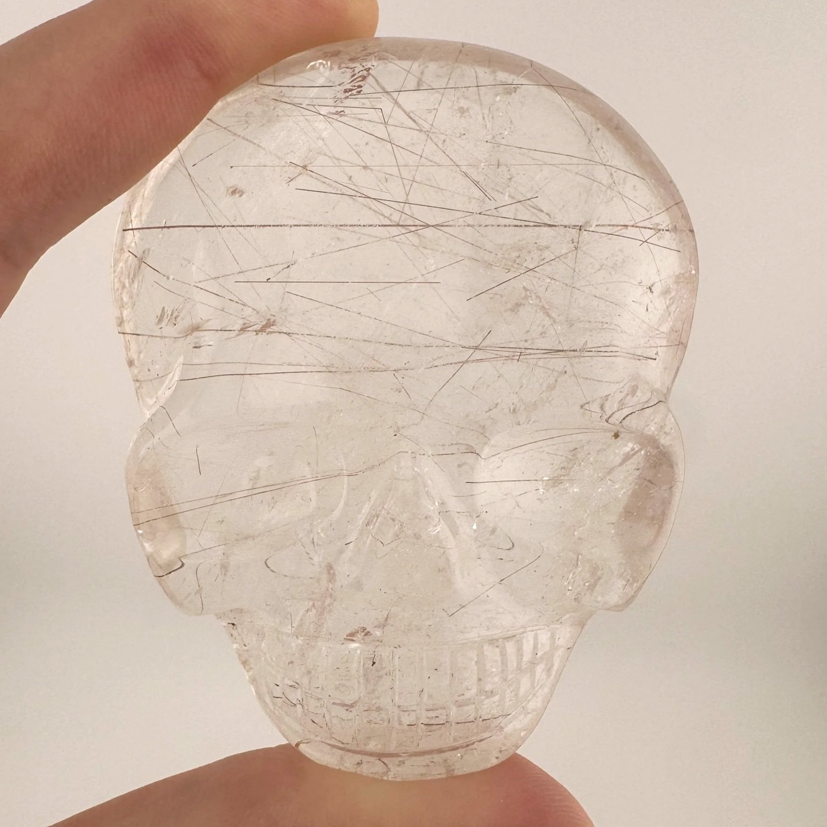 Leandro de Souza Red Rutile in Quartz Magical Child Palm Skull