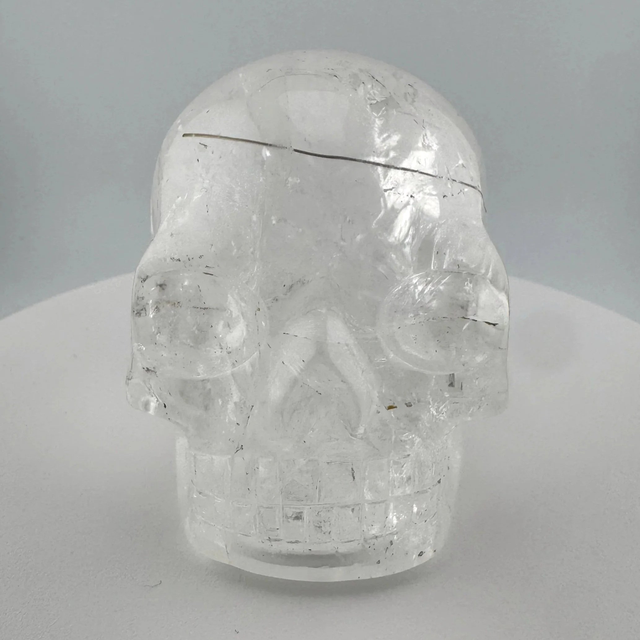 Red Rutile in Quartz Skull carved by Leandro de Souza