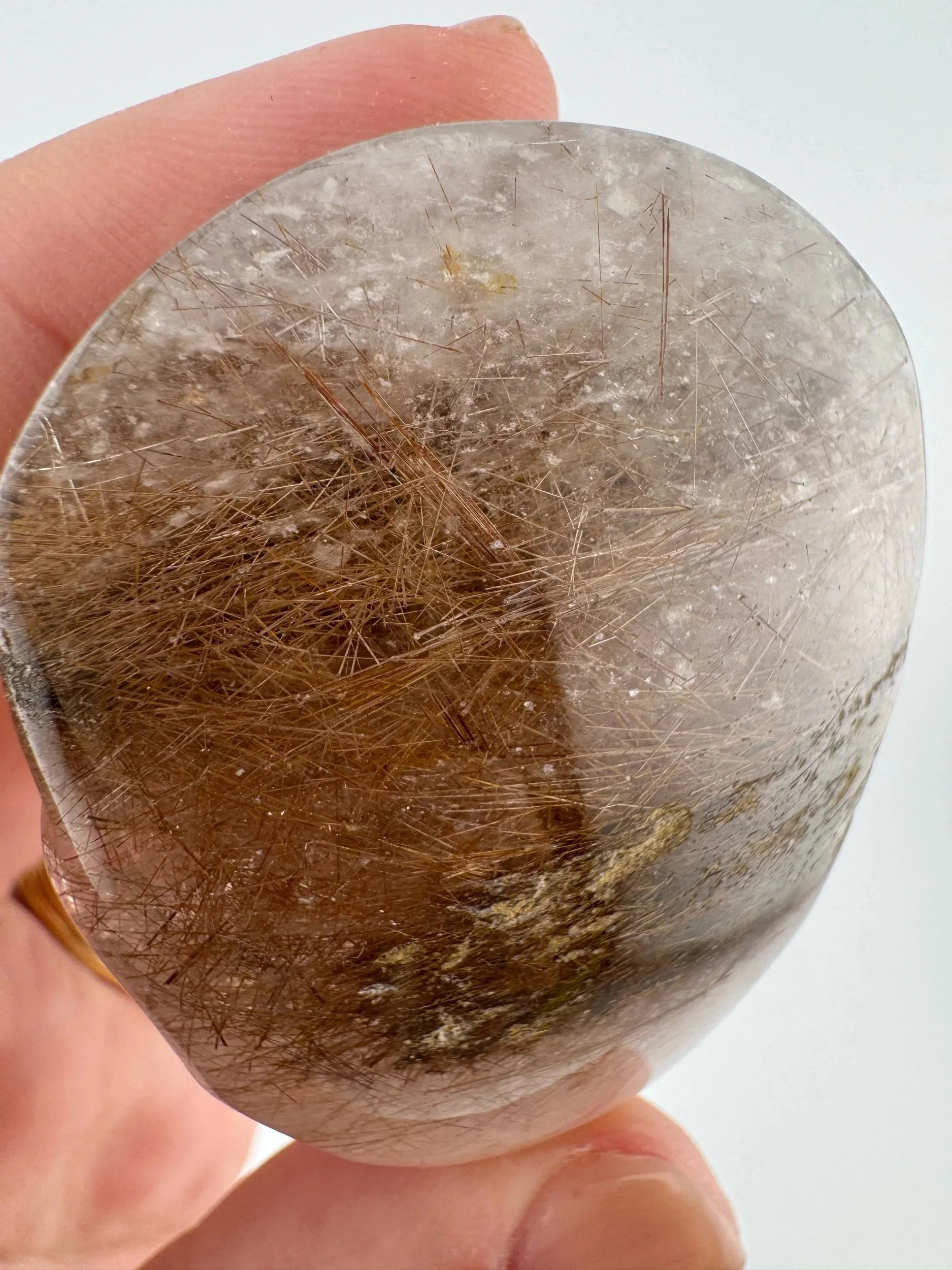 Leandro de Souza Red Rutile in Quartz Palm Skull