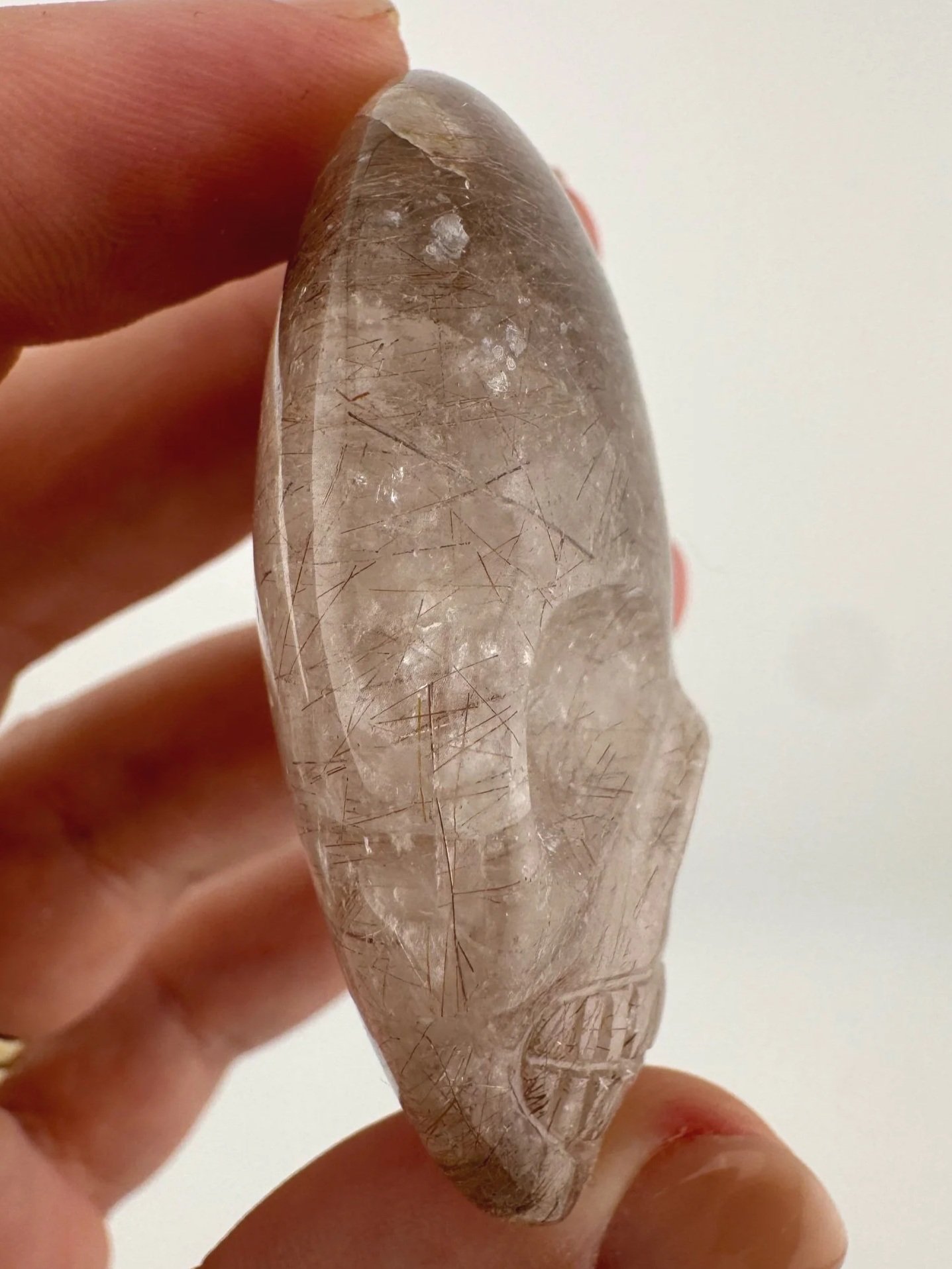 Leandro de Souza Red Rutile in Quartz Palm Skull