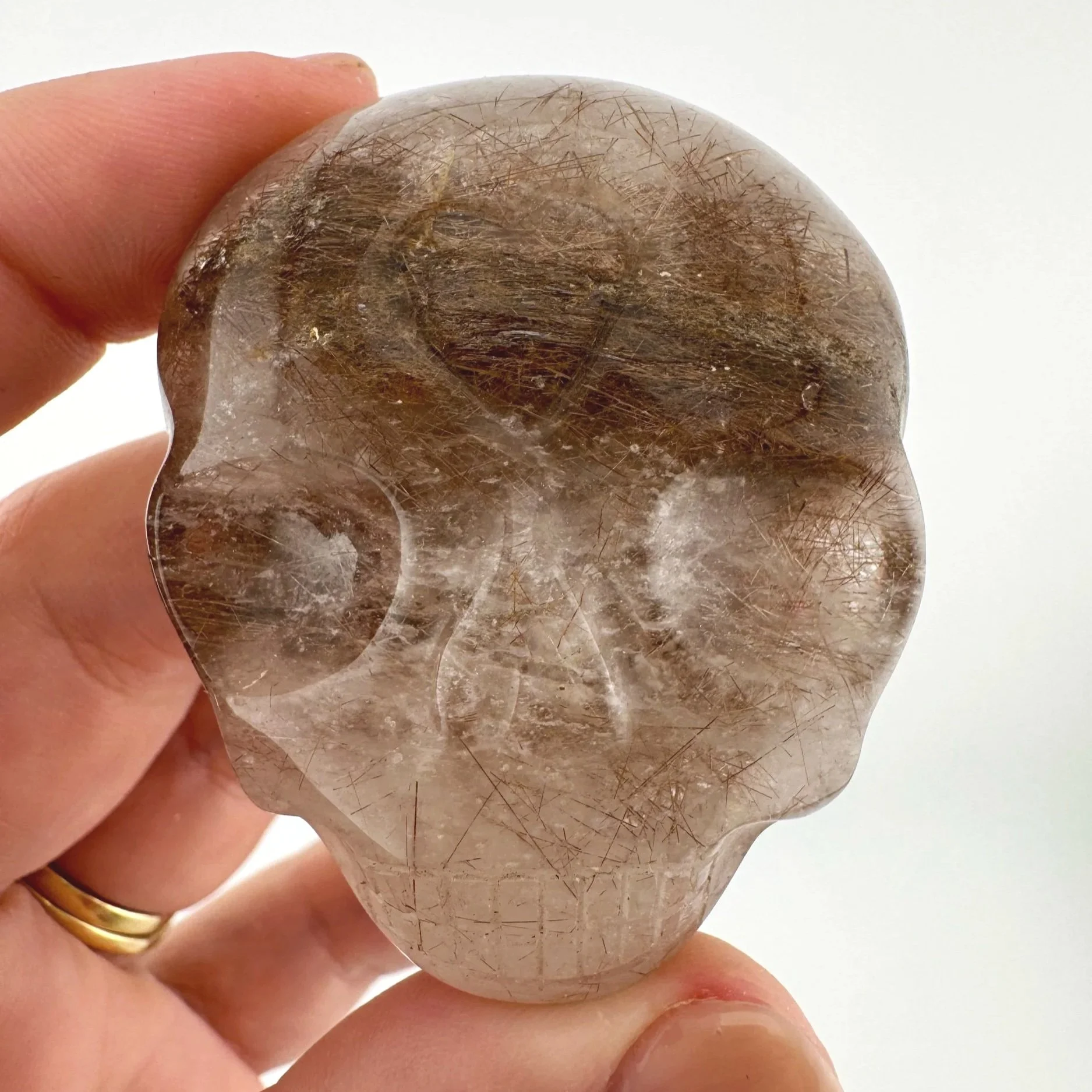 Leandro de Souza Red Rutile in Quartz Palm Skull