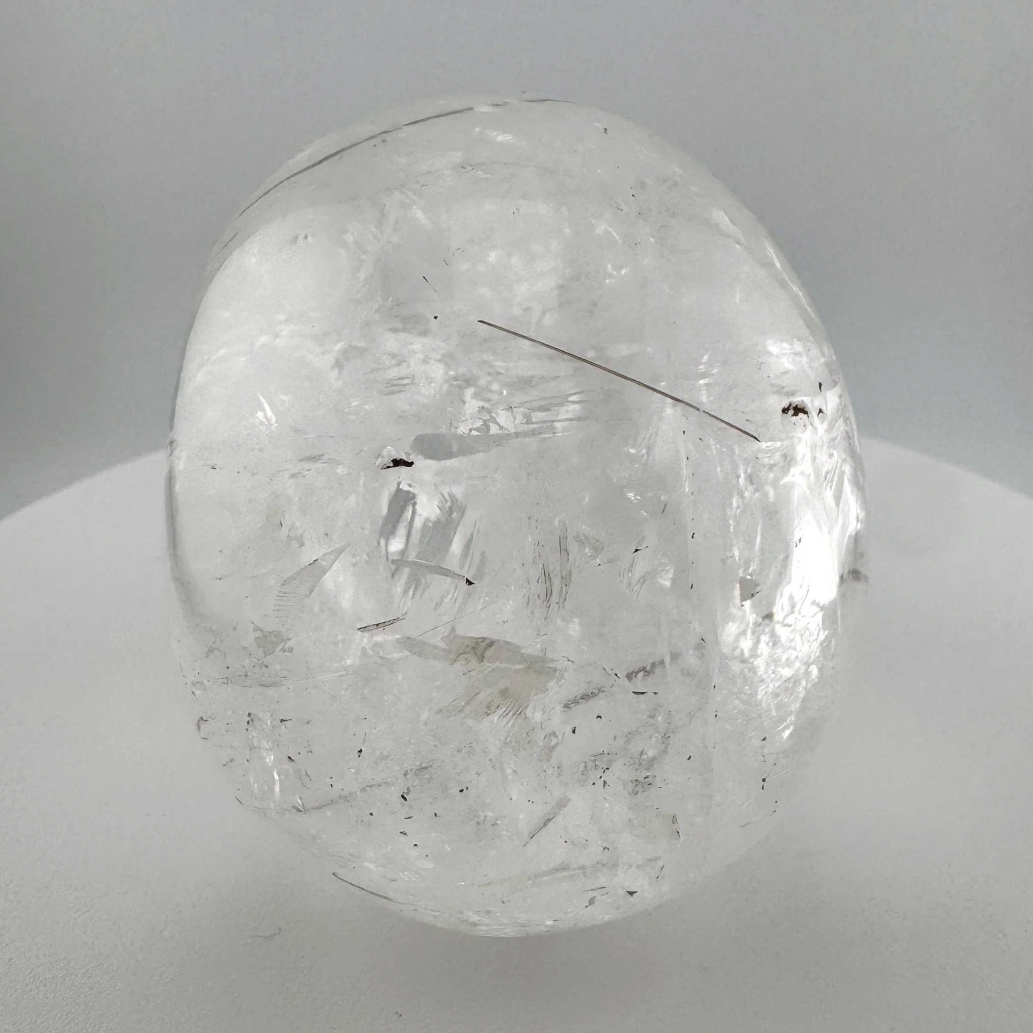 Red Rutile in Quartz Skull carved by Leandro de Souza