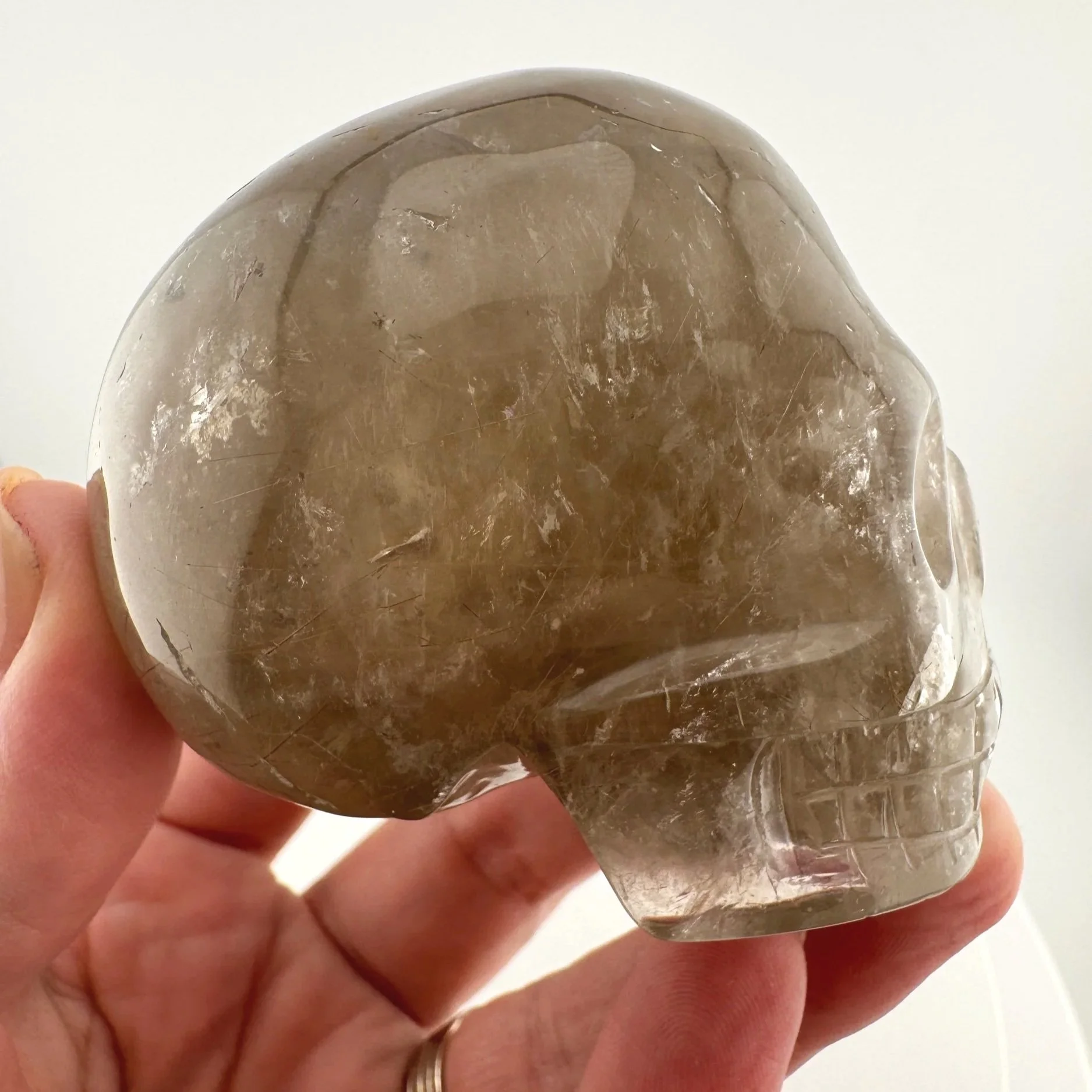 Red Rutile in Smoky Quartz Skull carved by Leandro de Souza