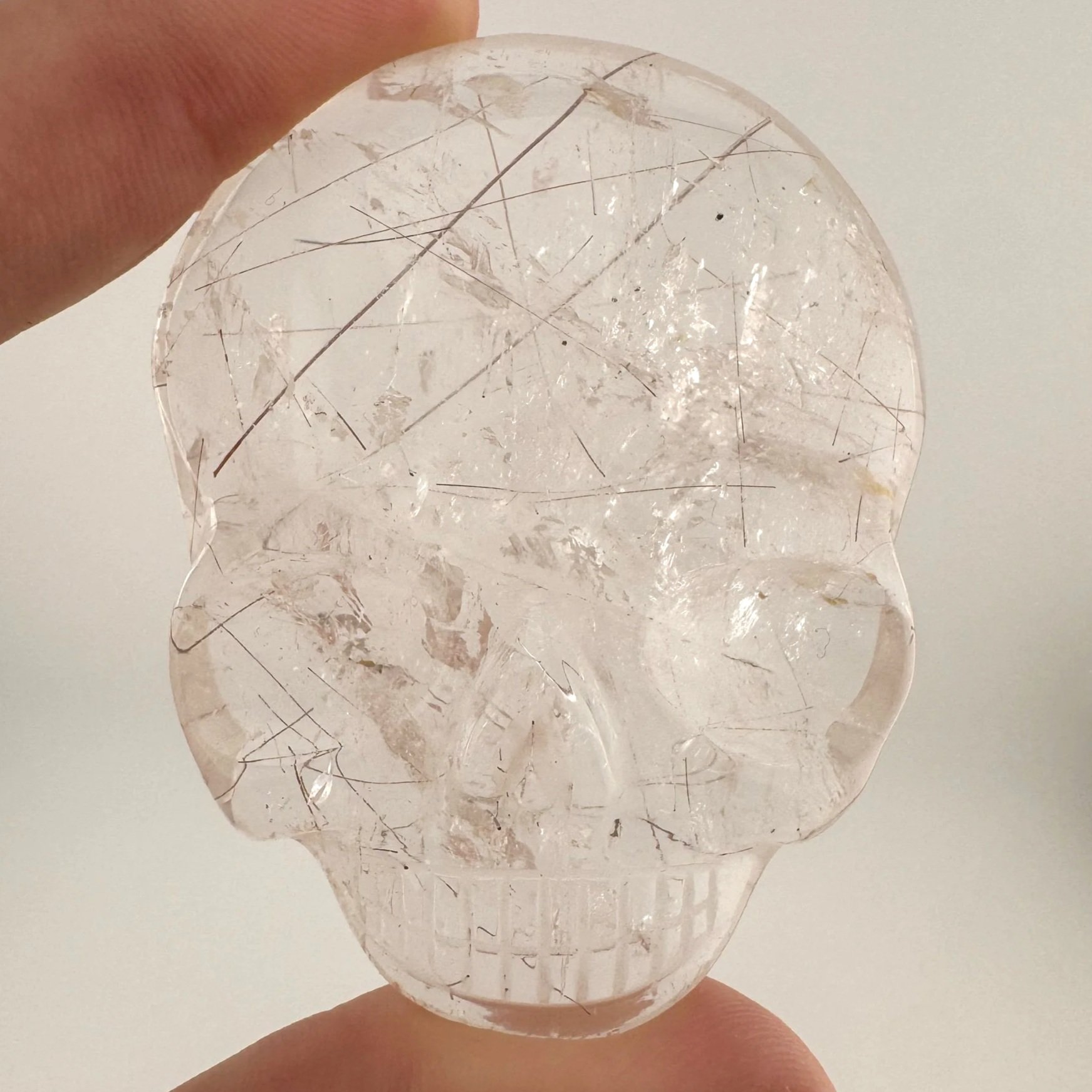 Leandro de Souza Red Rutile in Quartz Magical Child Palm Skull