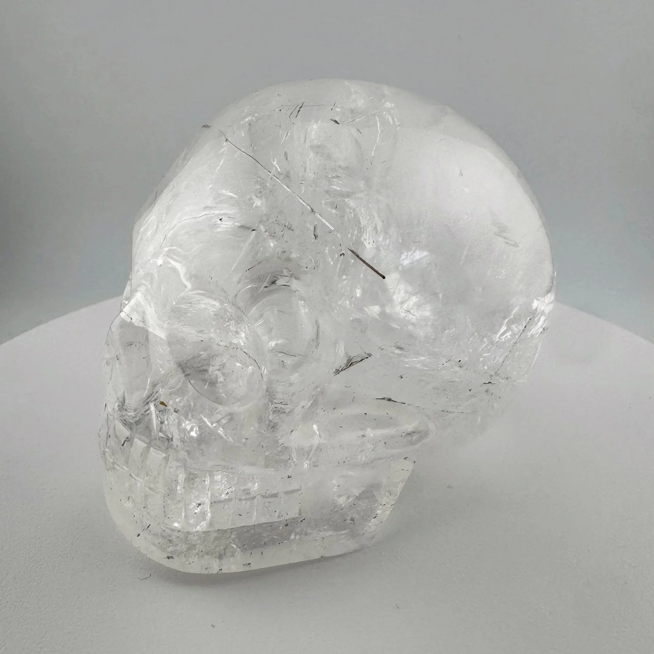 Red Rutile in Quartz Skull carved by Leandro de Souza