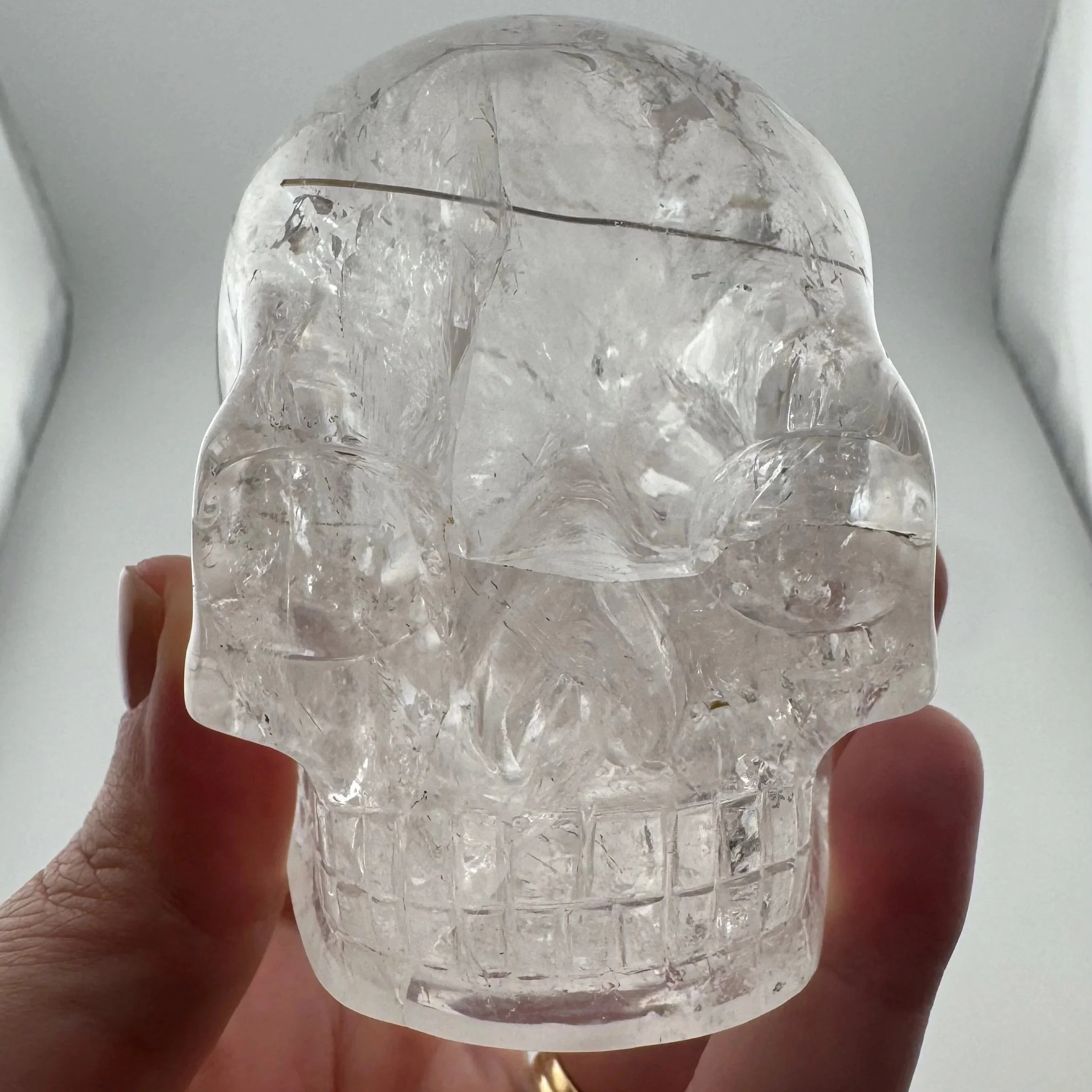Red Rutile in Quartz Skull carved by Leandro de Souza