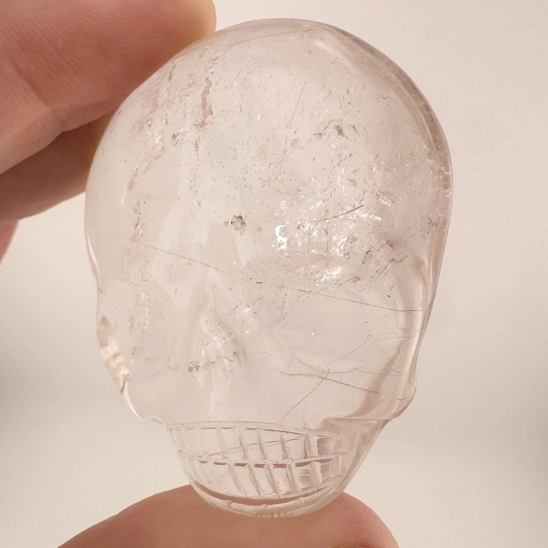 Leandro de Souza Red Rutile in Quartz Magical Child Palm Skull