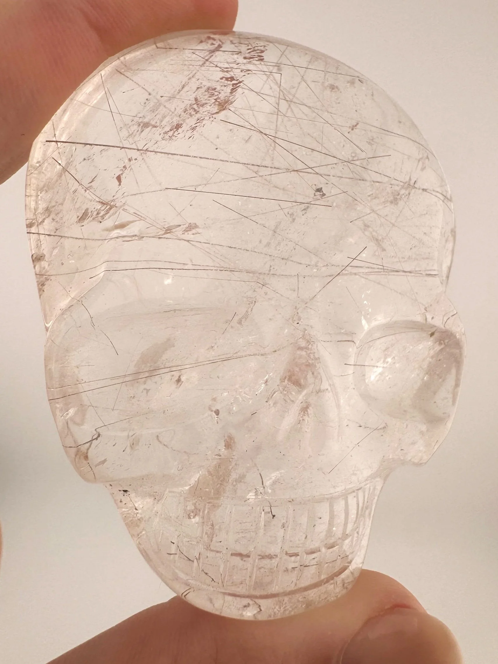 Leandro de Souza Red Rutile in Quartz Magical Child Palm Skull