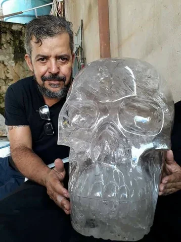 Leandro pictured with his skull Devine, an actinolite in quartz skull weighing 162kg.