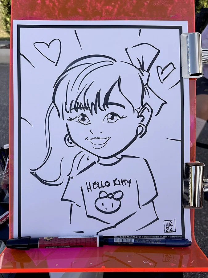 Line drawing of a young girl with long hair, a bow on her head, and big eyes smiling. She is wearing a shirt with a Hello Kitty face on it. There are hearts and lines around her head, indicating excitement or happiness.