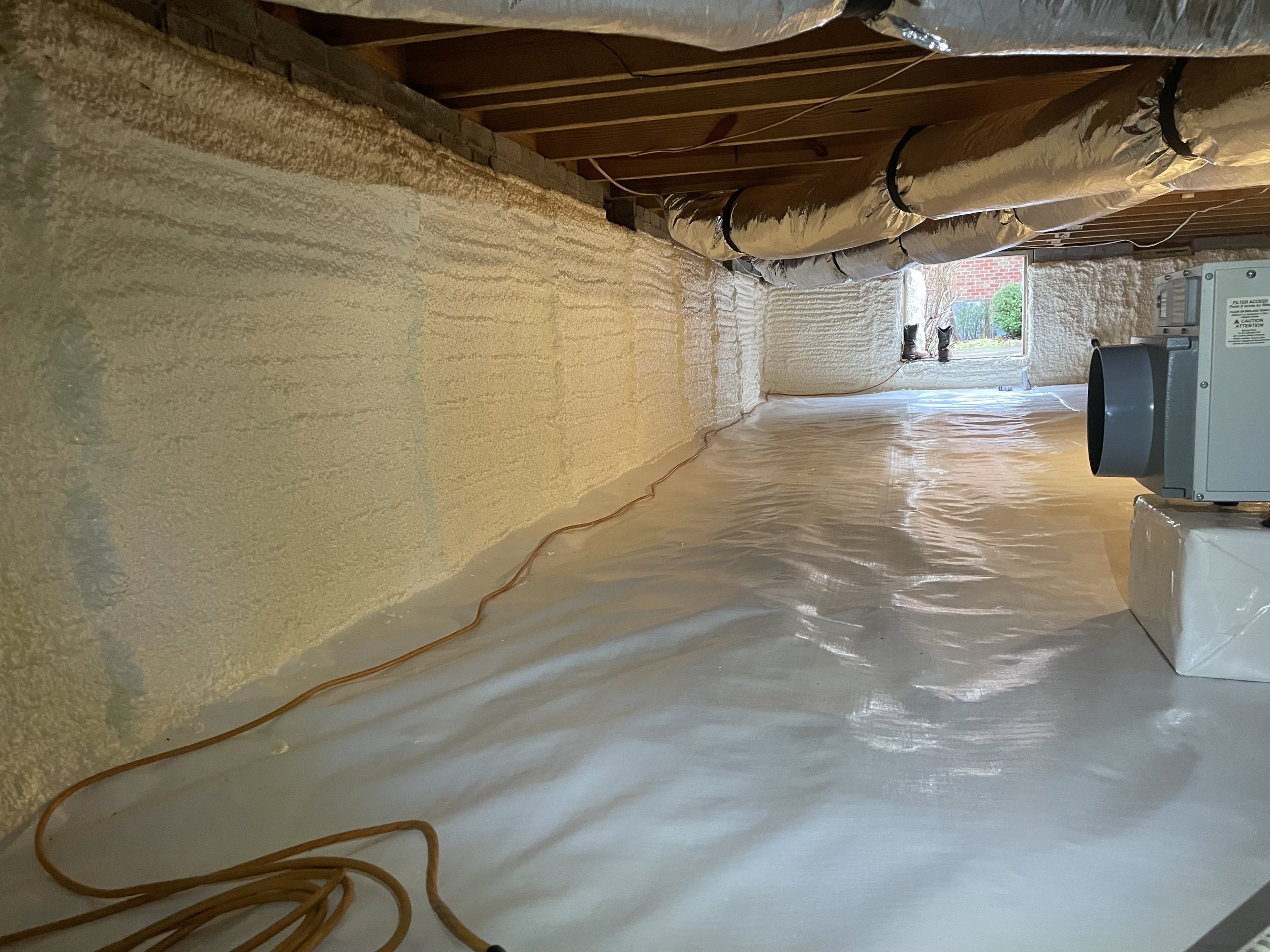 Statesville crawl space with spray foam foundation wall insulation, sealed vapor barrier and dehumidifier