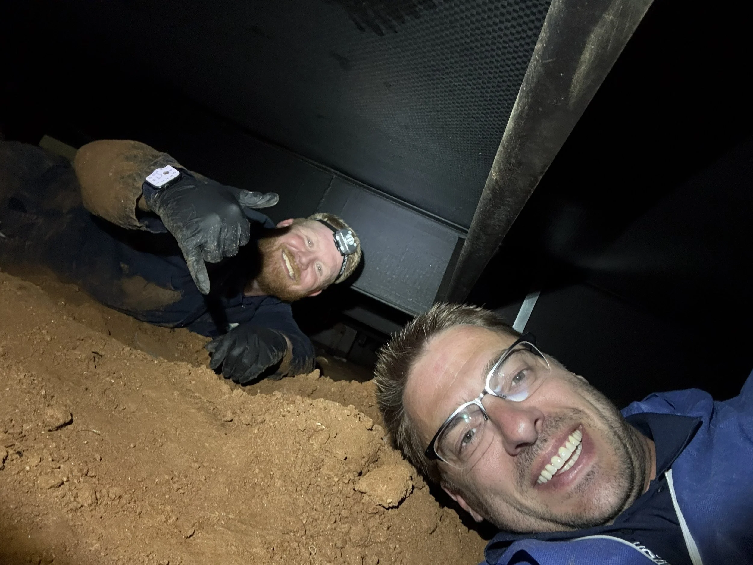 Southern founders Matt Cobb and Trevor Hovis working inside a Charlotte-area crawl space