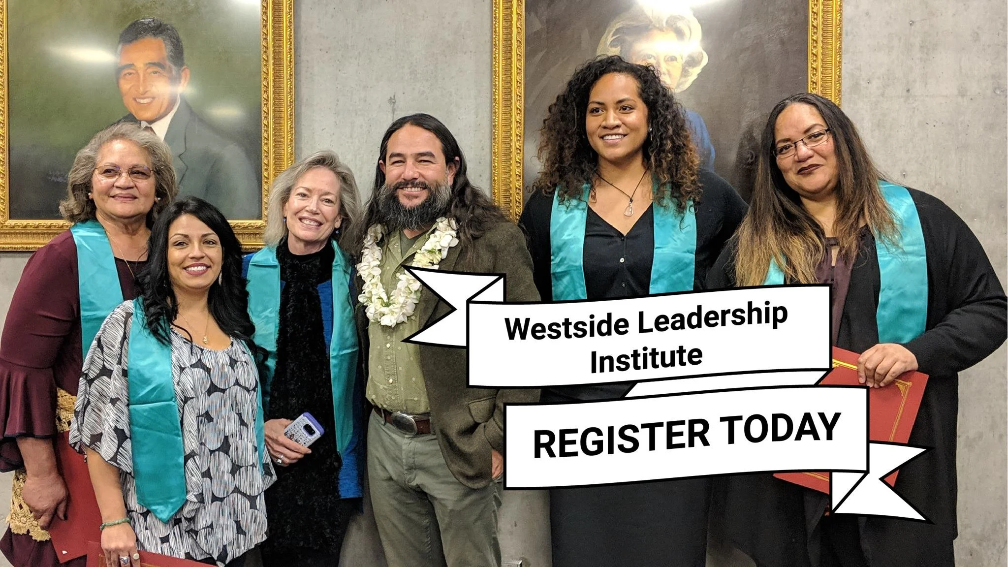 Group of six diverse women and one man posing in front of a wall with portraits, wearing academic regalia with teal sashes, signing a banner for the Westside Leadership Institute.