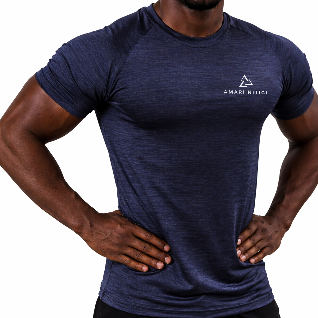 Close-up of a man with muscular arms wearing a navy blue athletic t-shirt with white logo and text 'AMARI NITICI' on the chest, standing with hands on hips.