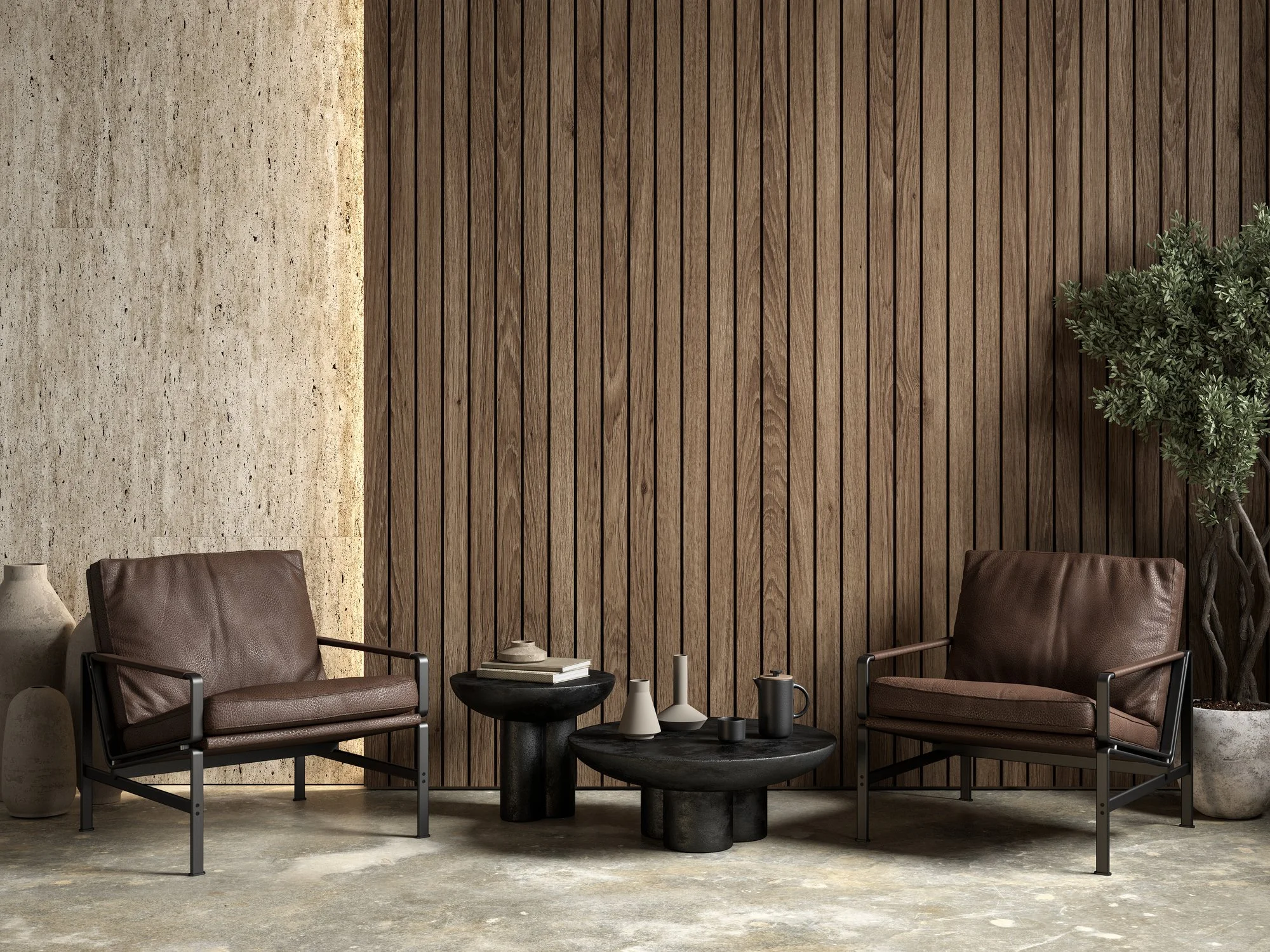 Modern living room with two brown leather armchairs, a black round coffee table, decorative vases, a textured concrete wall, a wooden panel accent wall, and a tall green potted plant.