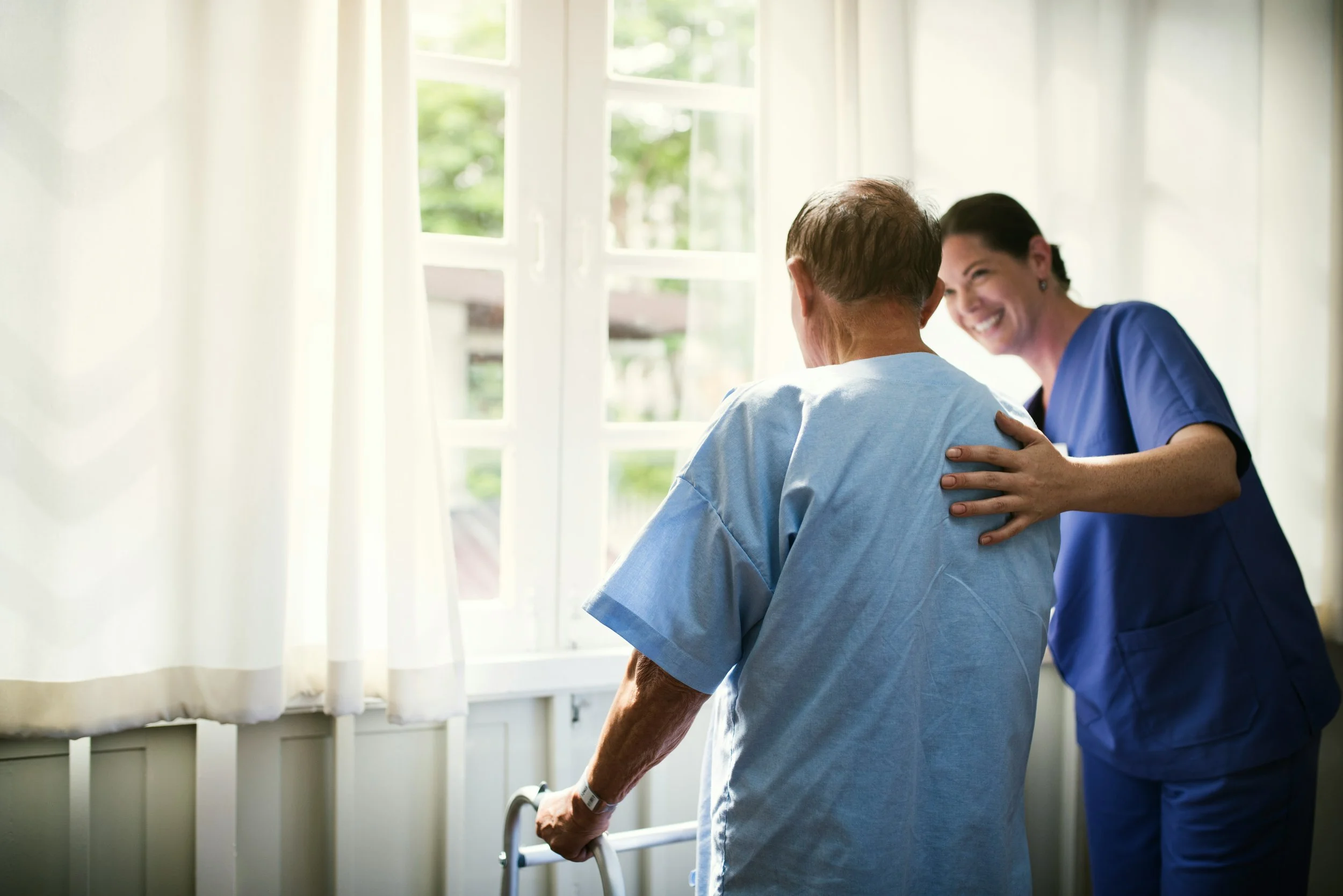 Compassionate nurse advocate helping senior age in place safely with professional hospital care coordination and family communication.